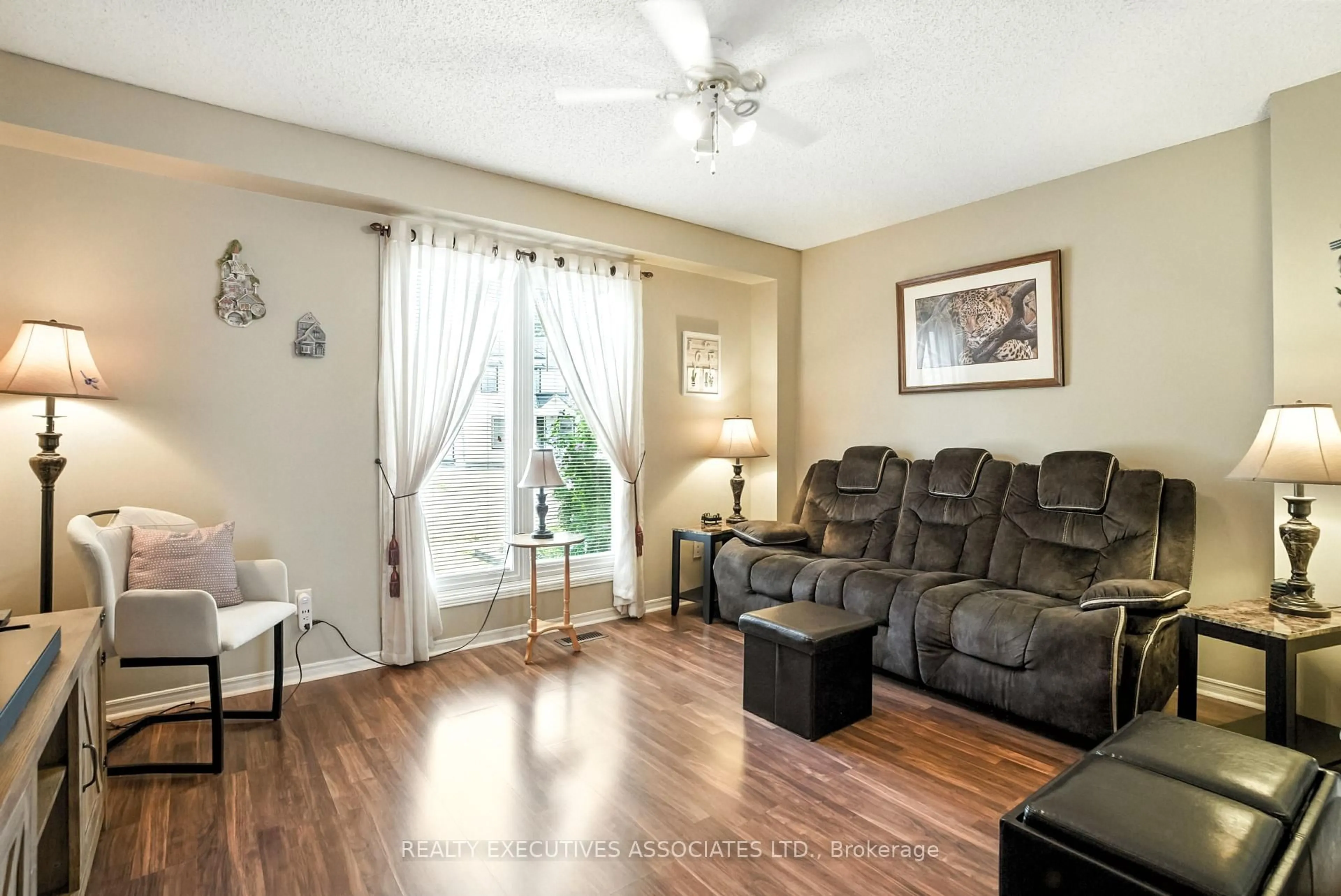 Living room with furniture, wood/laminate floor for 77B Queen St, Clarington Ontario L1C 1M5