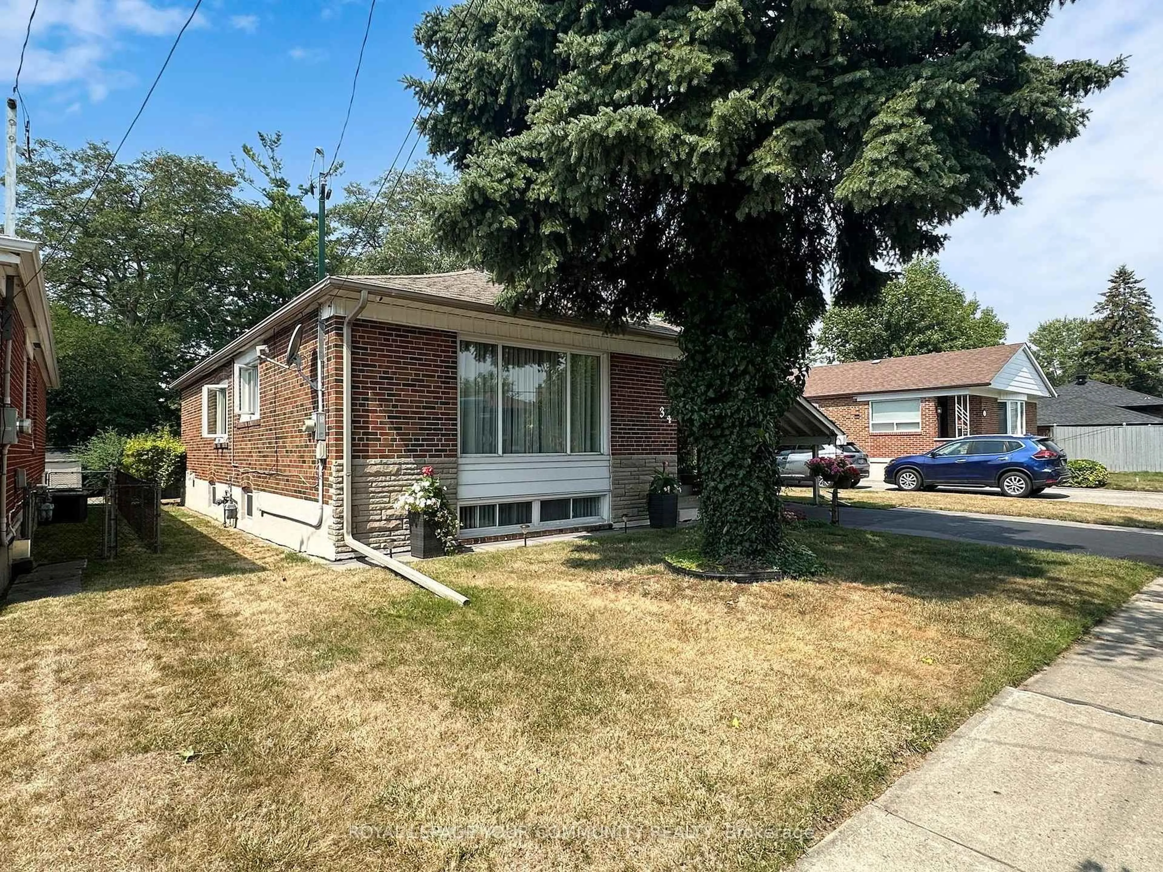 Home with brick exterior material, street for 34 Droxford Ave, Toronto Ontario M1R 1K2