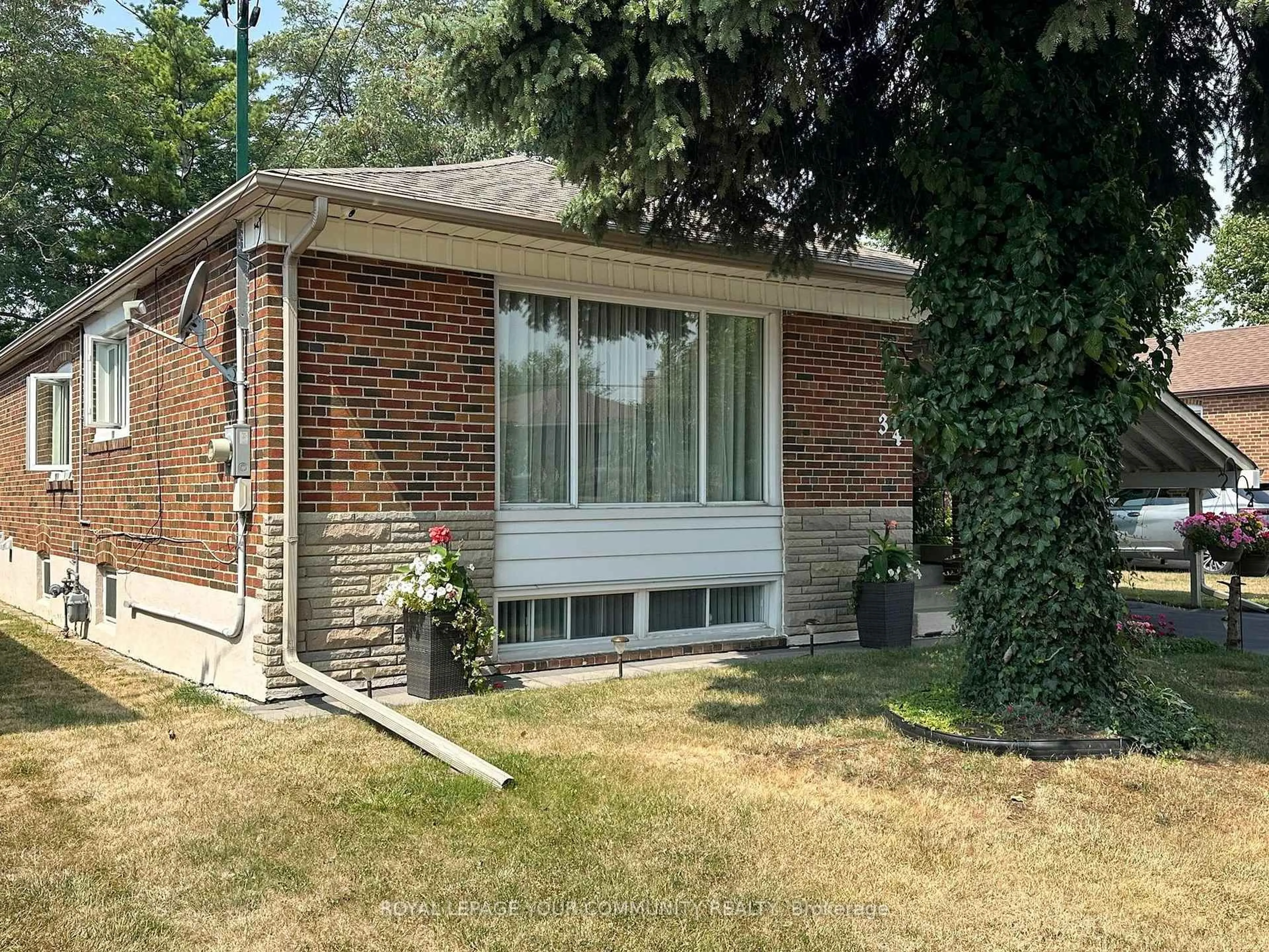 Home with brick exterior material, street for 34 Droxford Ave, Toronto Ontario M1R 1K2