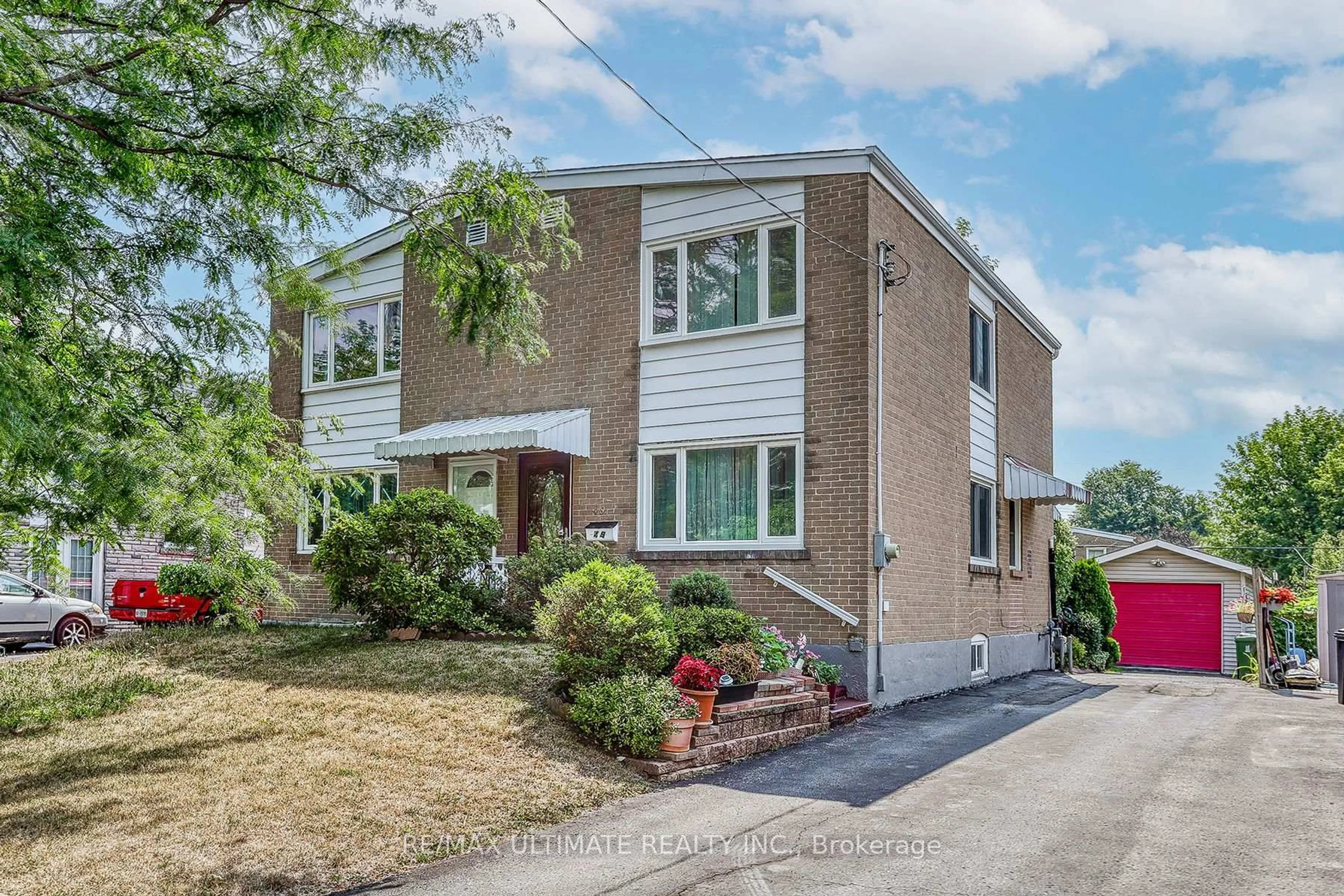 Home with brick exterior material, street for 49 Ashwick Dr, Toronto Ontario M1K 2L1