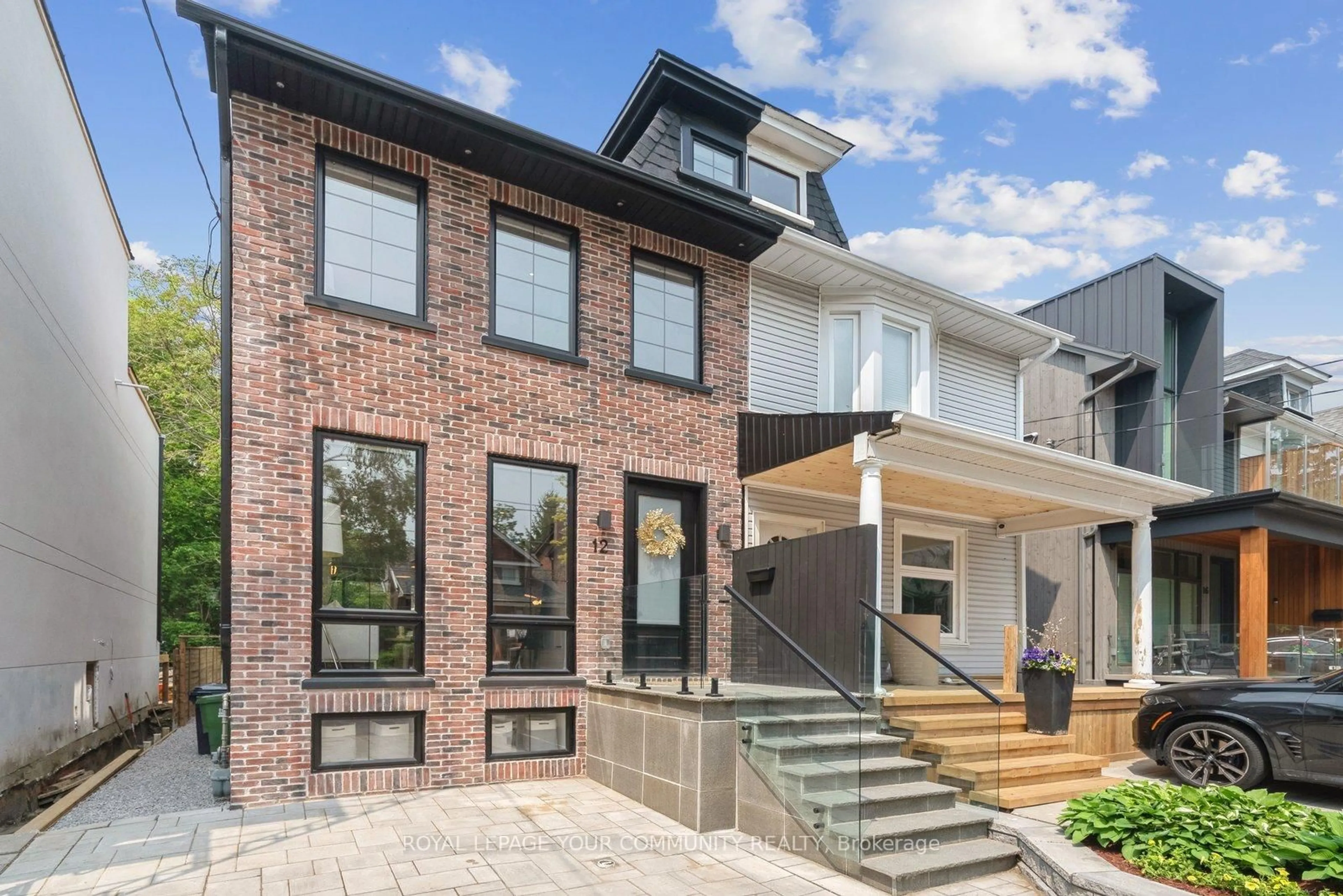 Home with brick exterior material, street for 12 Wheeler Ave, Toronto Ontario M4L 3V2
