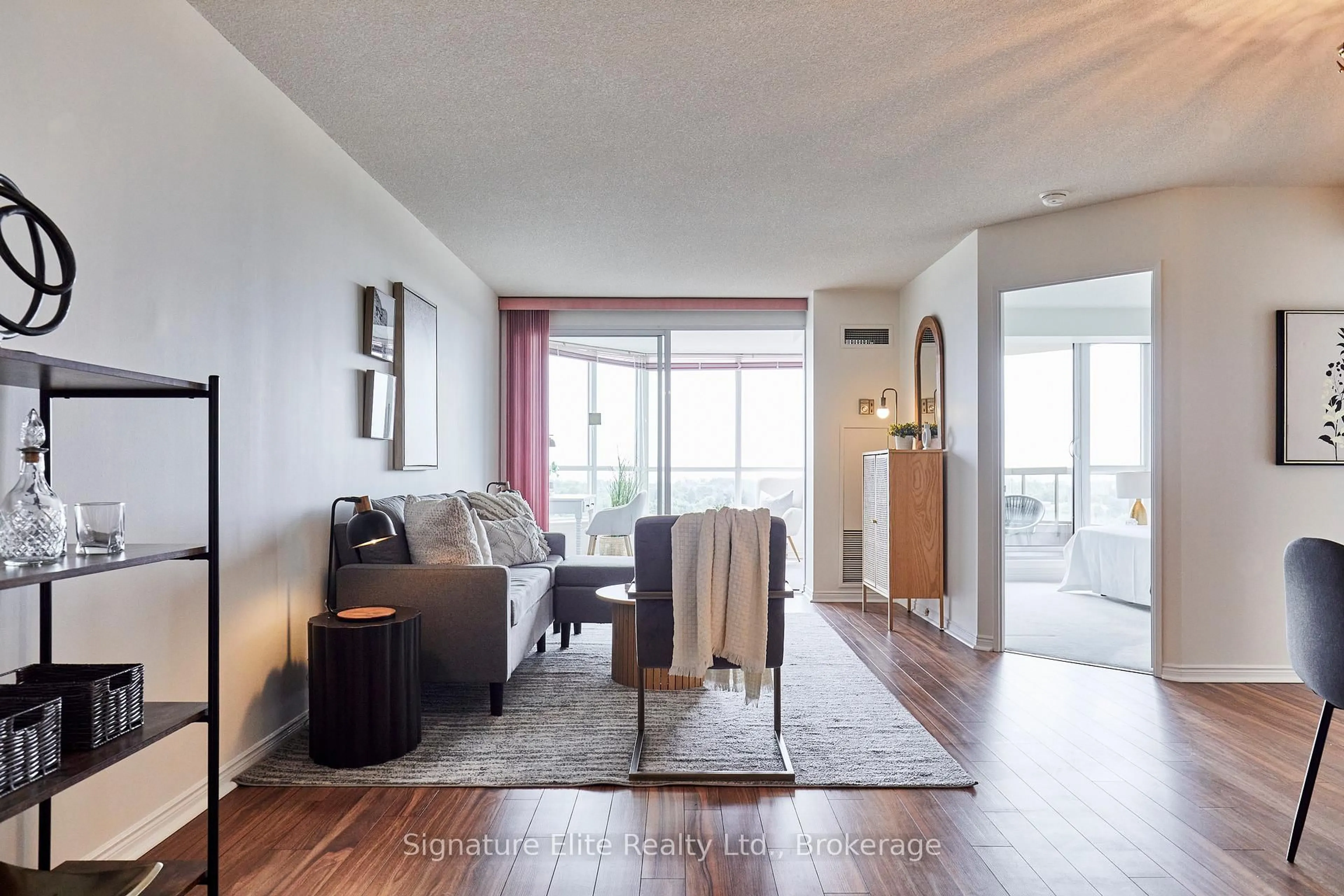 Living room with furniture, wood/laminate floor for 10 Guildwood Pkwy #621, Toronto Ontario M1E 5B5
