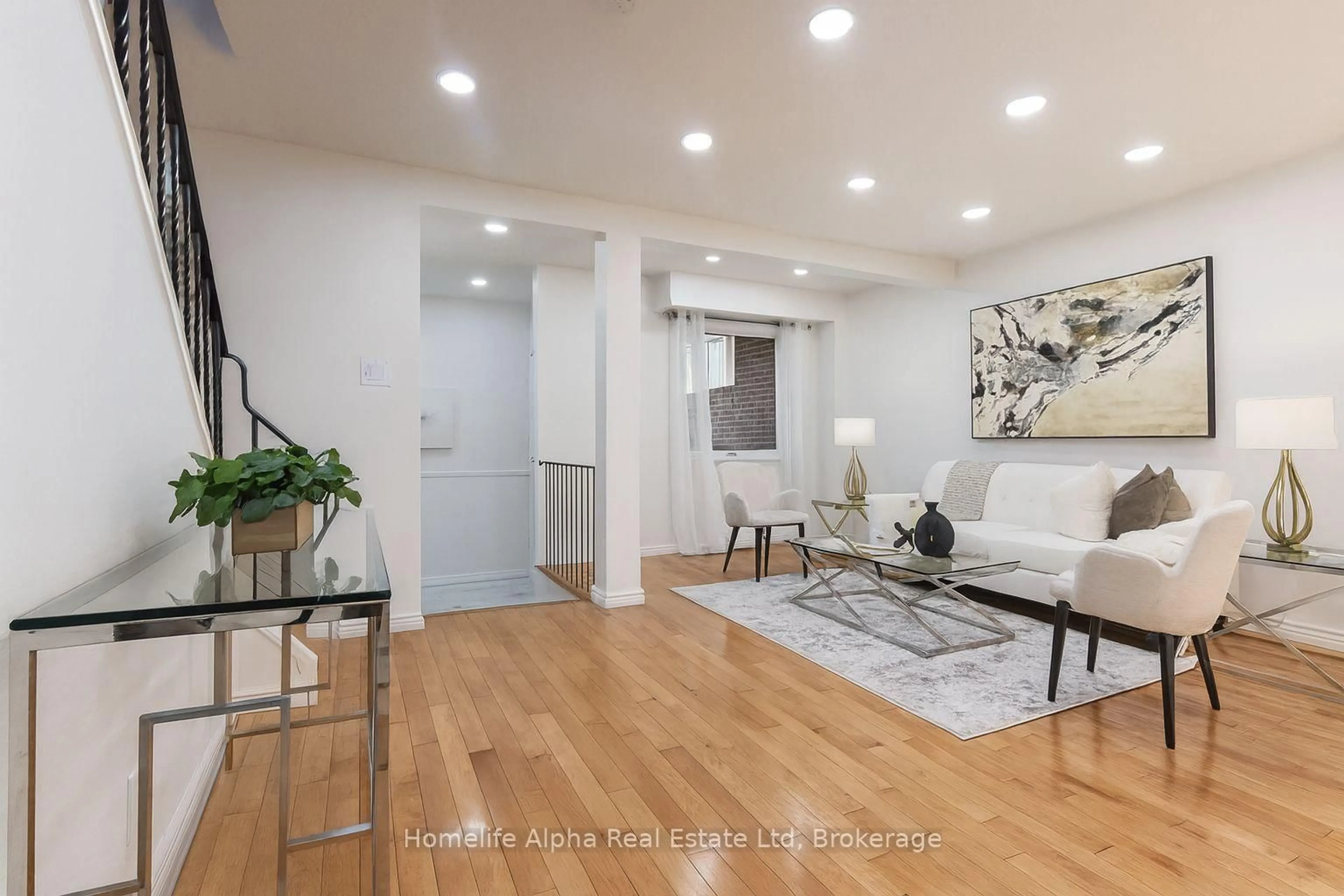 Living room with furniture, wood/laminate floor for 63 Homedale Dr, Toronto Ontario M1V 1M1