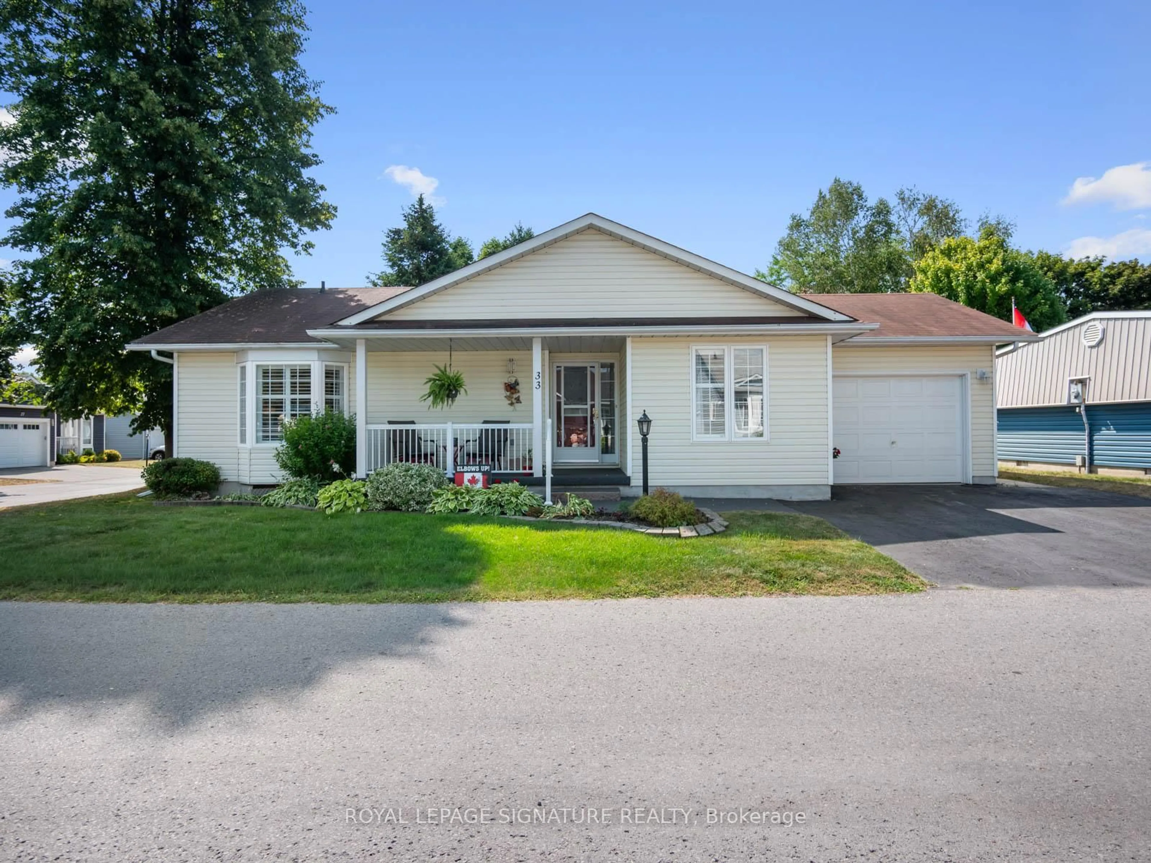 Home with vinyl exterior material, street for 33 Steelhead Lane, Clarington Ontario L1B 1B3