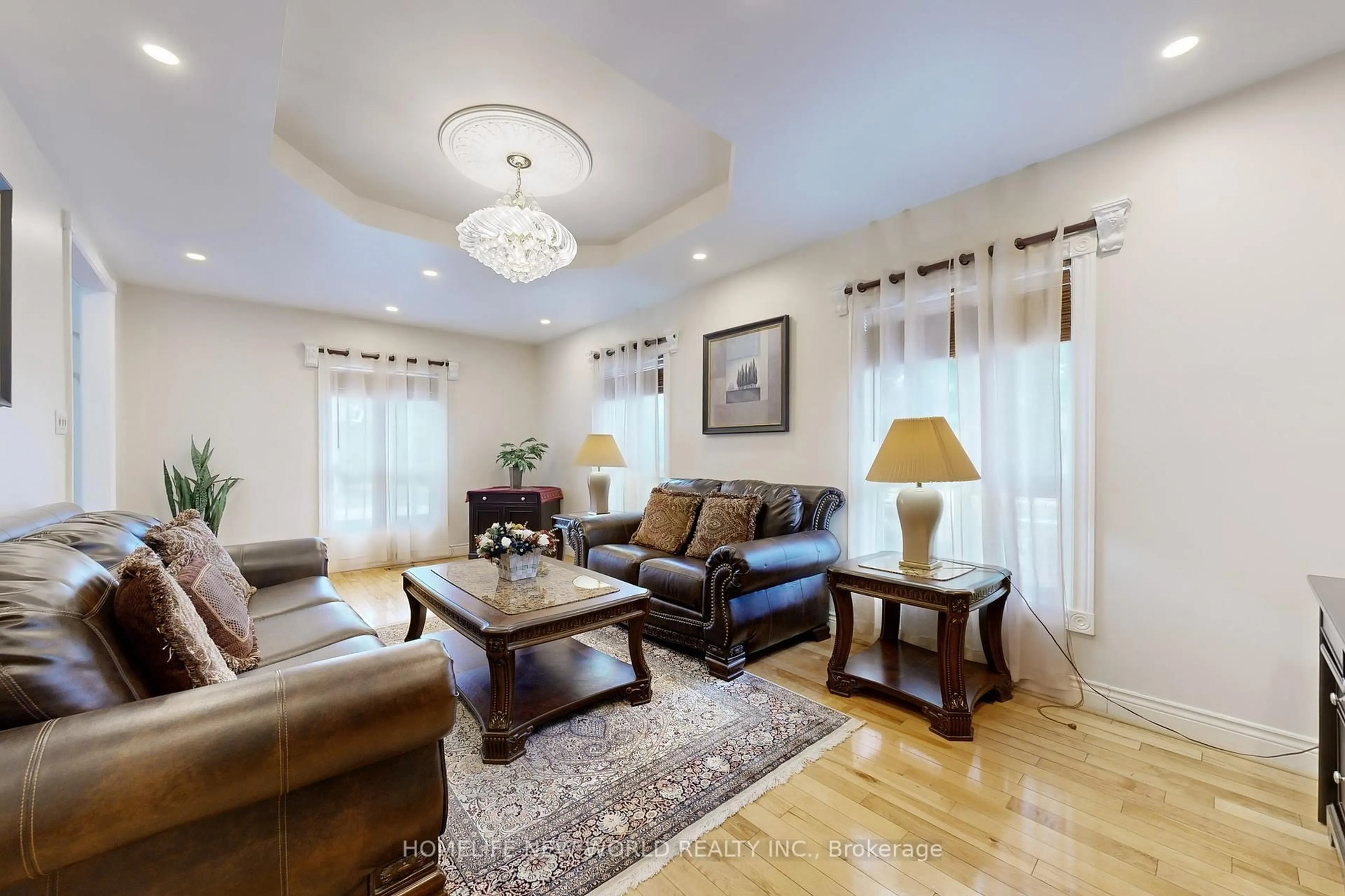 Living room with furniture, unknown for 781 Huntingwood Dr, Toronto Ontario M1T 2L5