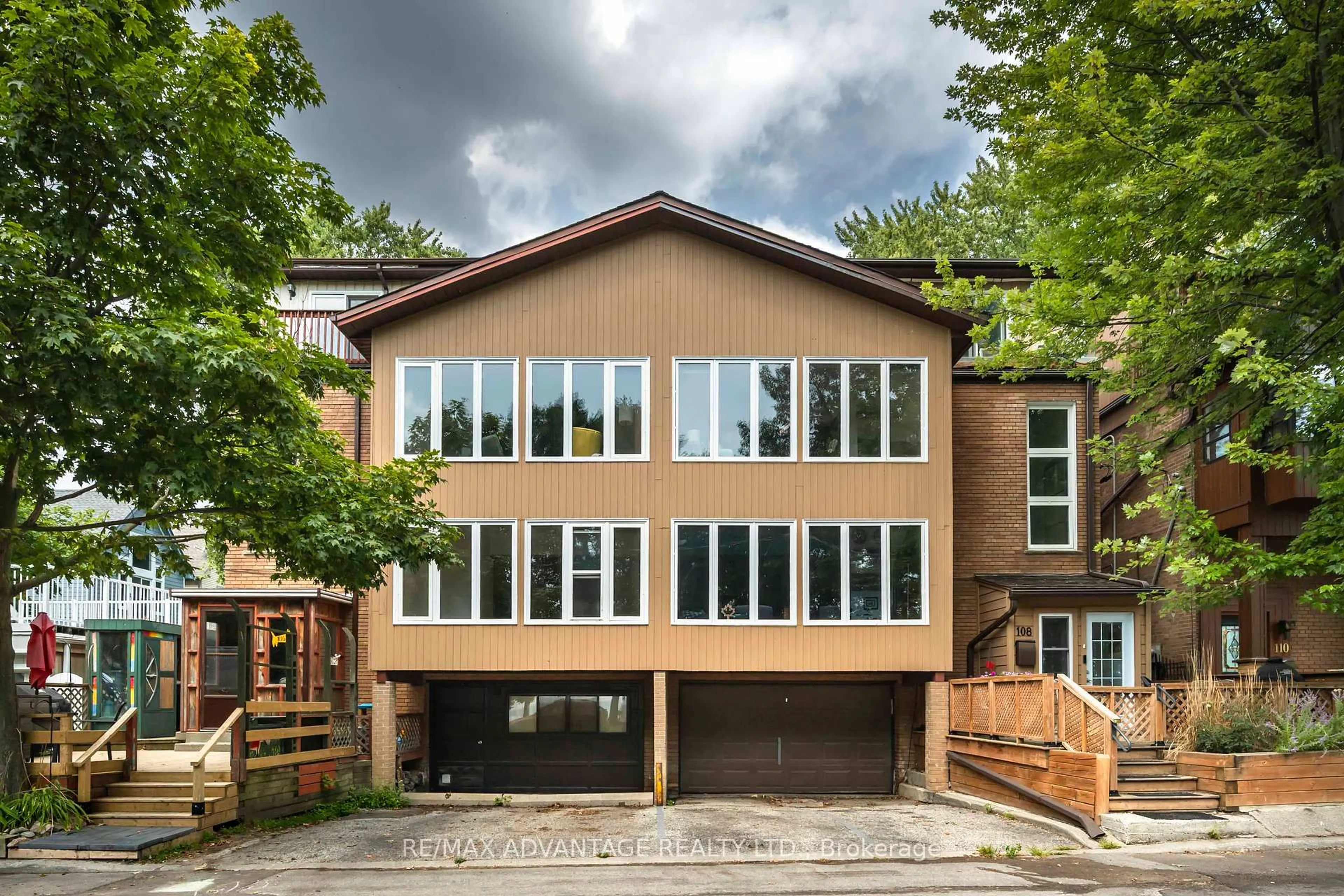 Home with brick exterior material, street for 106 Hubbard Blvd #1 + 2, Toronto Ontario M4E 1A6