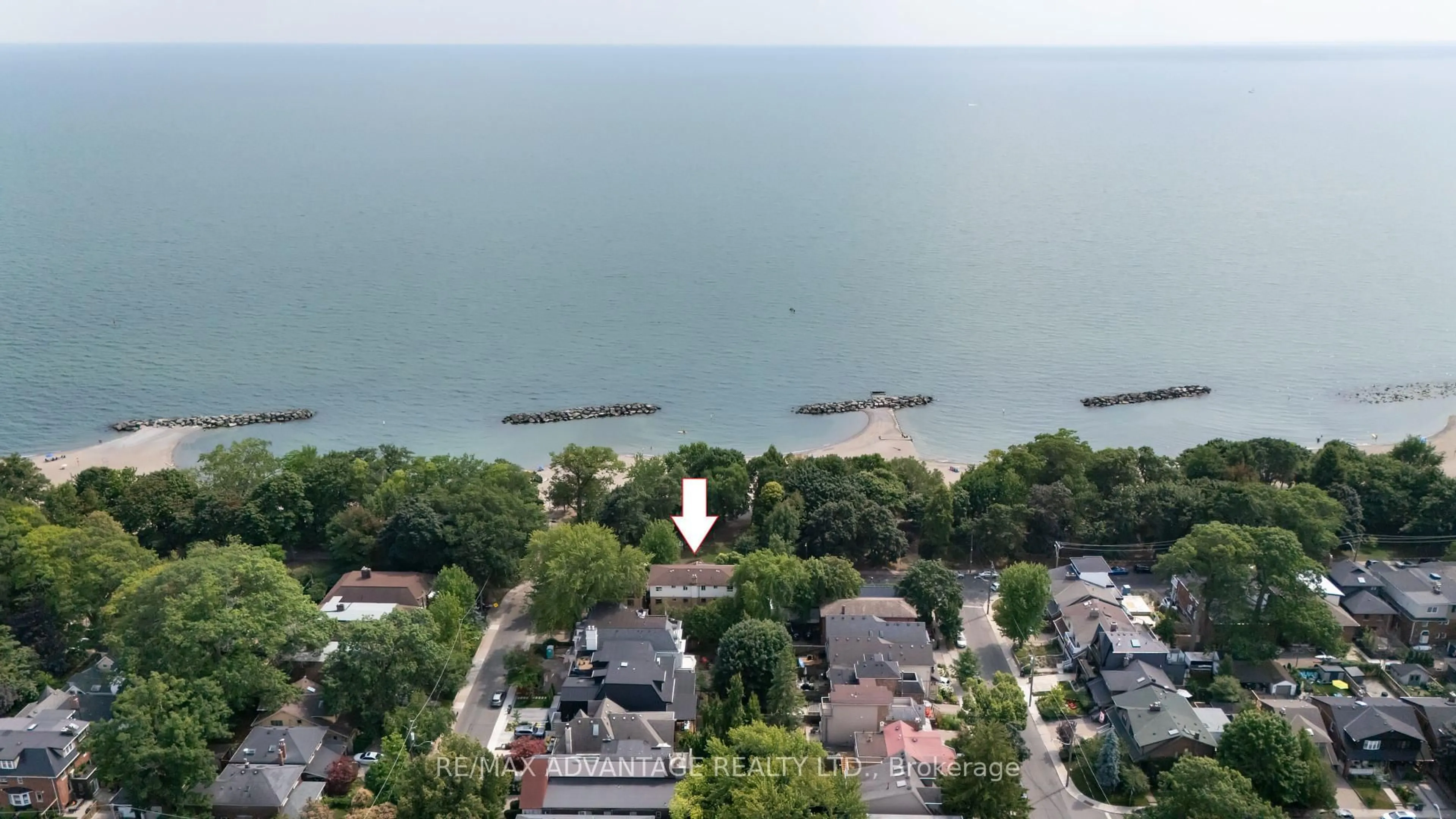 A pic from outside/outdoor area/front of a property/back of a property/a pic from drone, water/lake/river/ocean view for 106 Hubbard Blvd #1 + 2, Toronto Ontario M4E 1A6