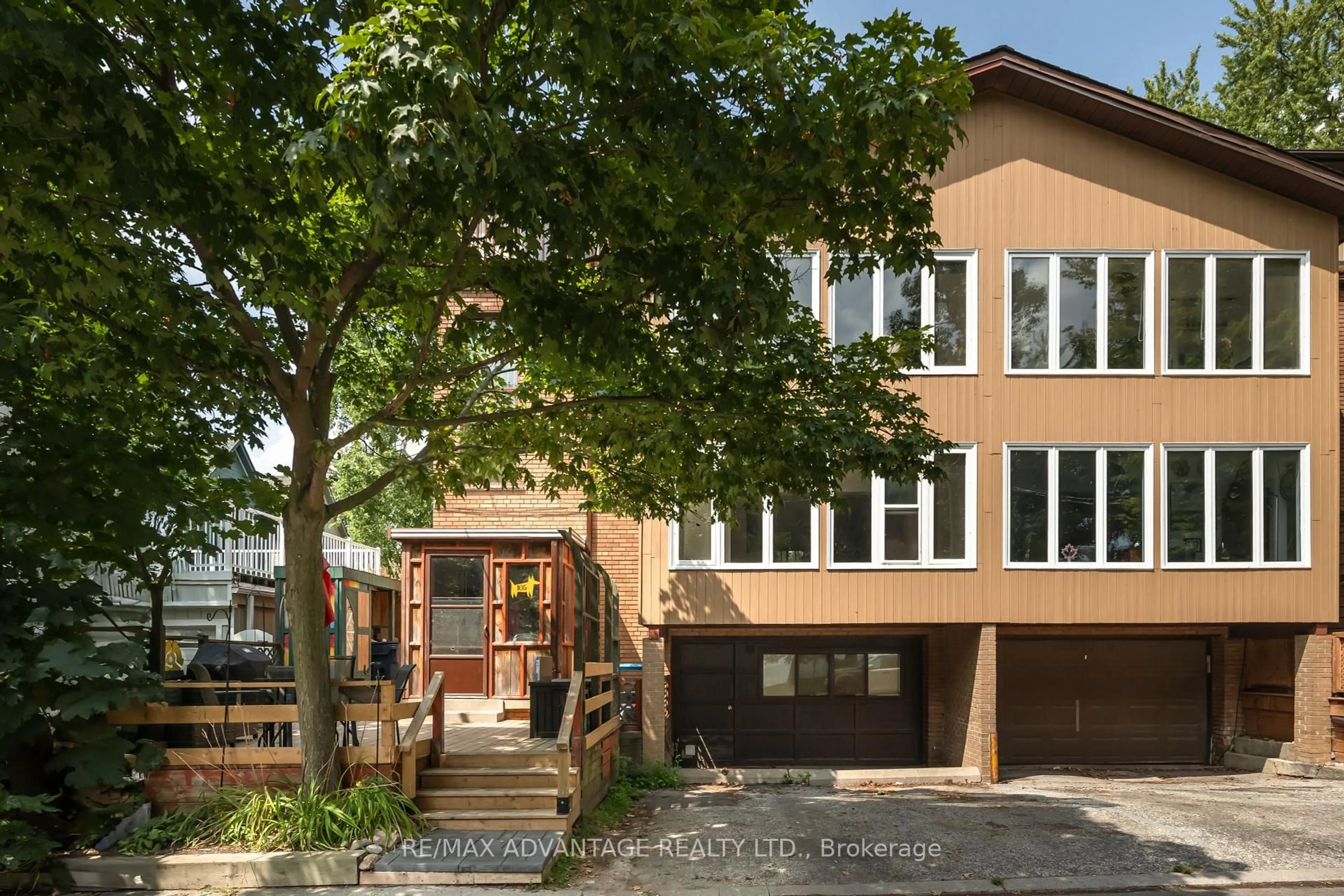 Home with brick exterior material, street for 106 Hubbard Blvd #1 + 2, Toronto Ontario M4E 1A6