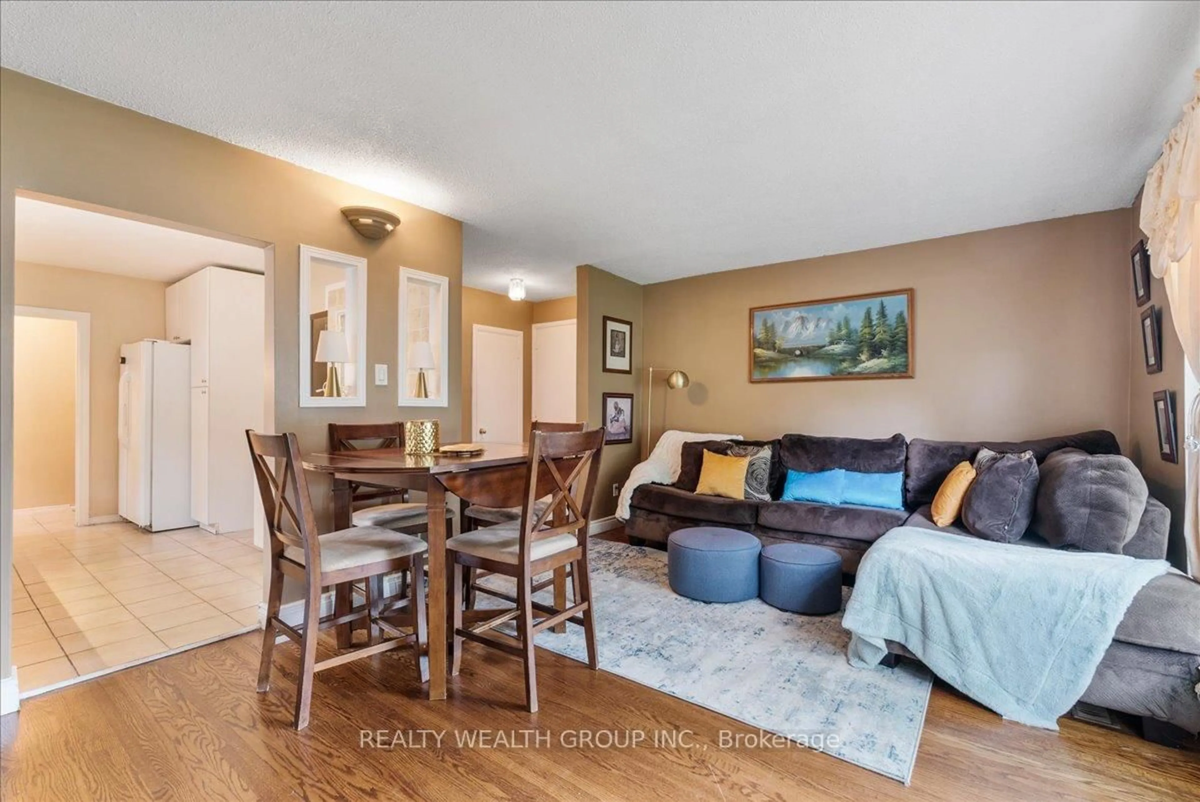 Living room with furniture, wood/laminate floor for 53 Northfield Rd, Toronto Ontario M1G 2H5