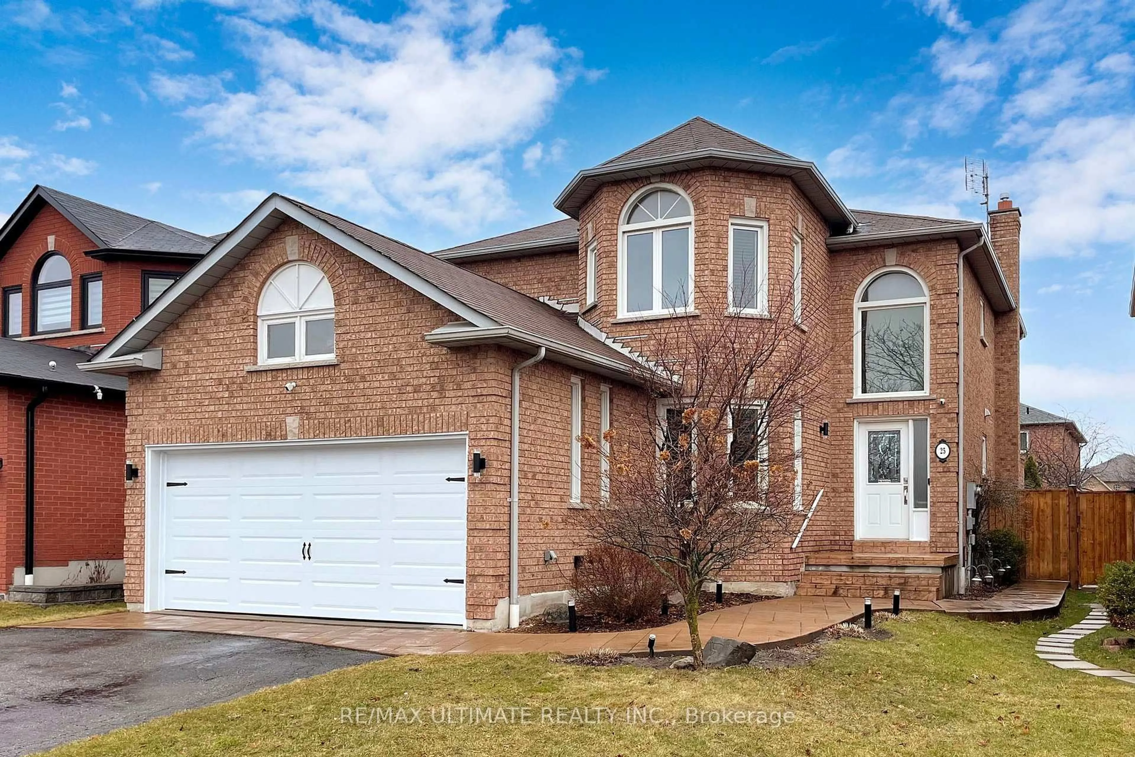 Home with brick exterior material, street for 25 WINTERBERRY Dr, Whitby Ontario L1R 1Z2