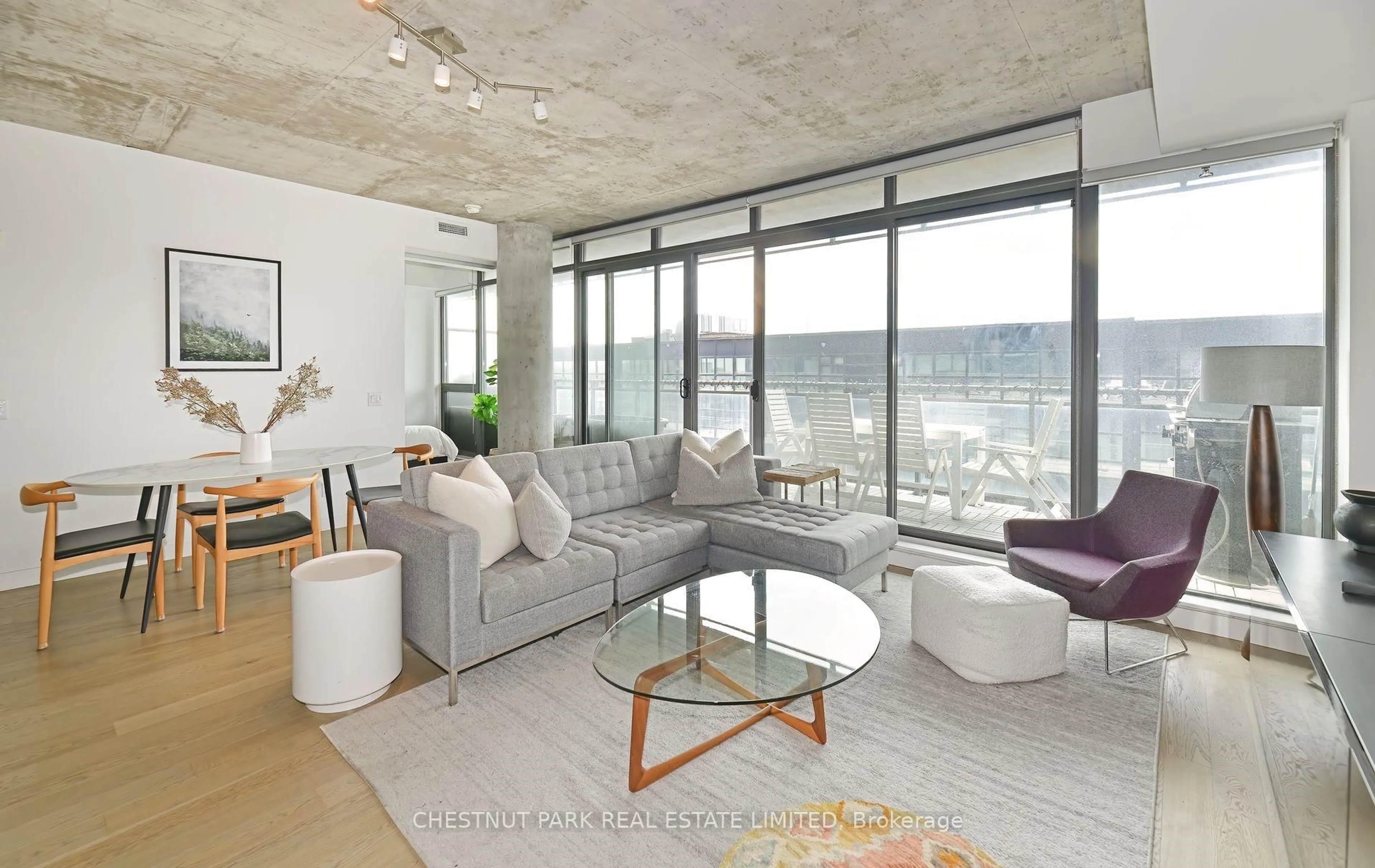Living room with furniture, cement floor for 90 Broadview Ave #806, Toronto Ontario M4M 3H3