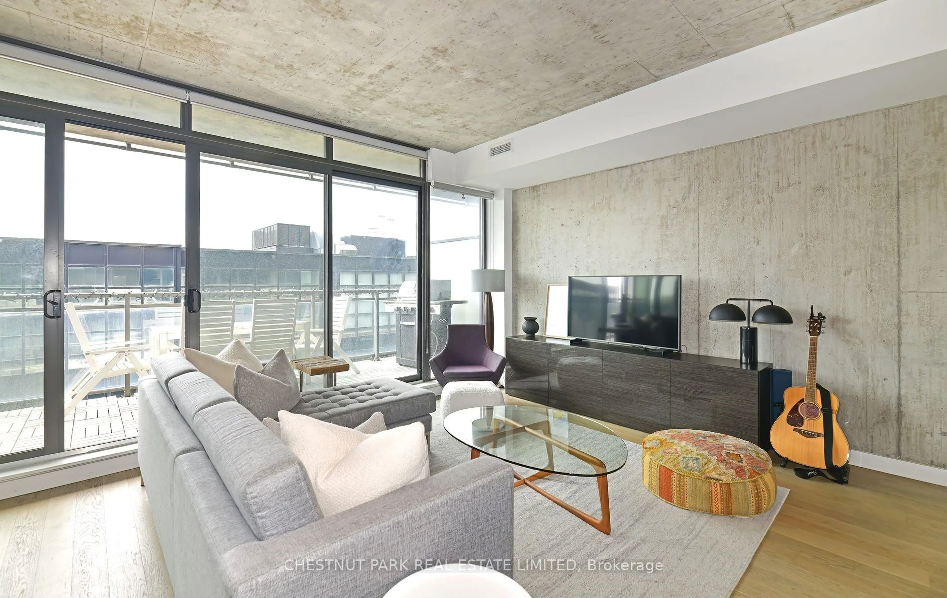 Living room with furniture, cement floor for 90 Broadview Ave #806, Toronto Ontario M4M 3H3