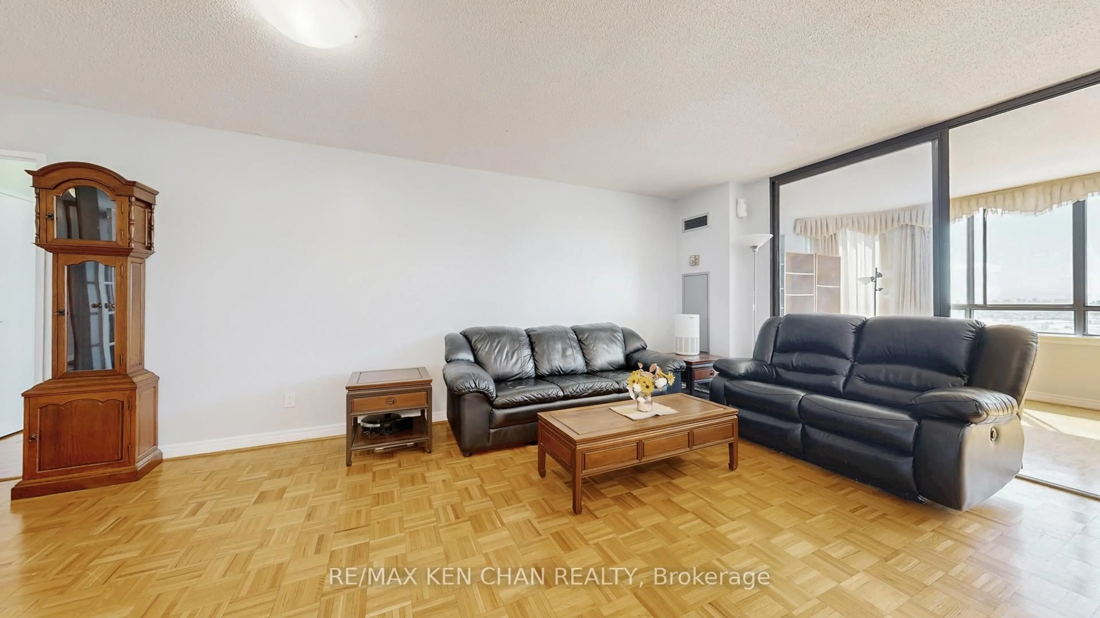 Living room with furniture, wood/laminate floor for 75 Bamburgh Circ #1917, Toronto Ontario M1W 3W1