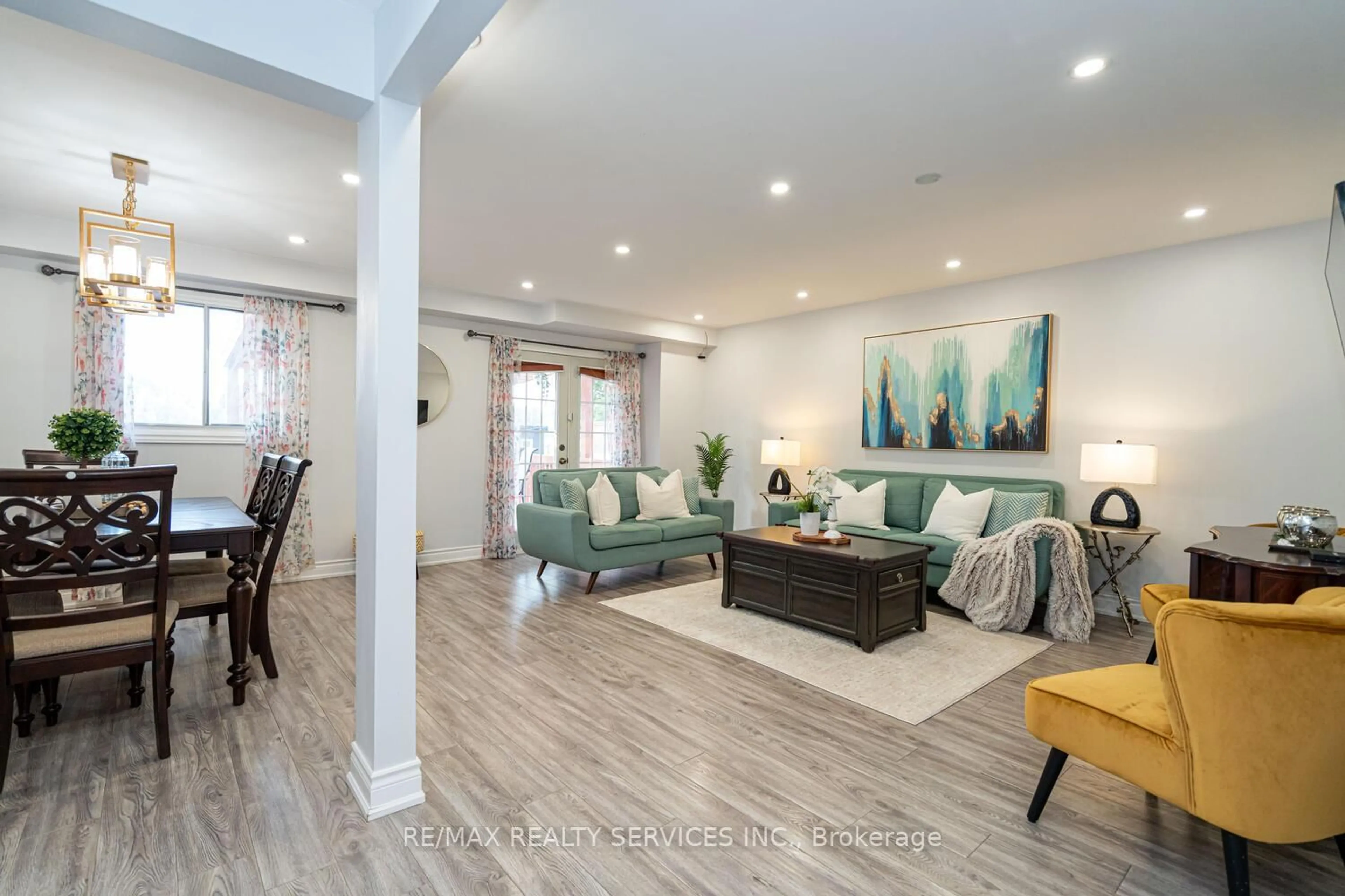 Living room with furniture, wood/laminate floor for 1330 Brands Crt, Pickering Ontario L1V 2V4