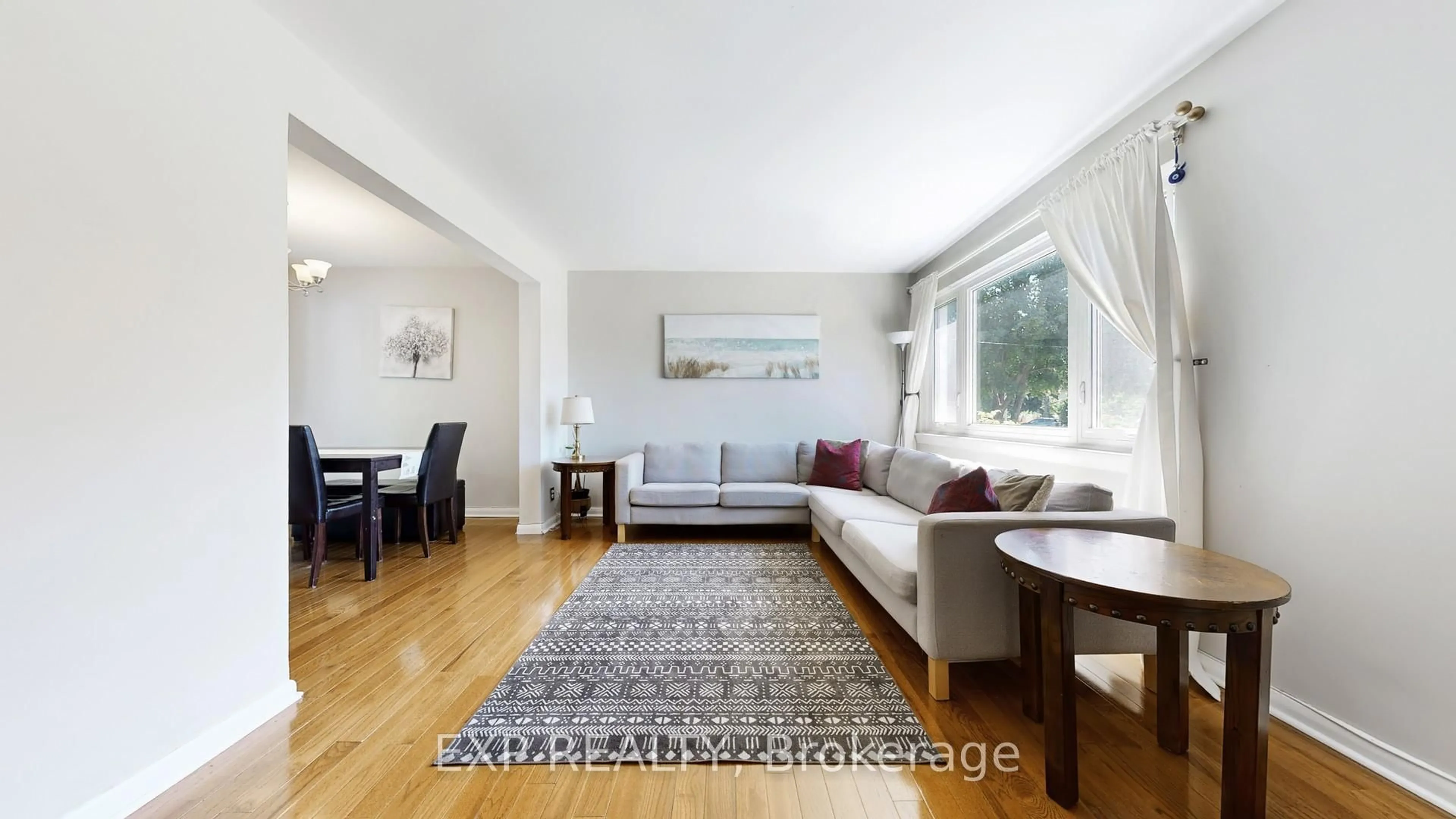 Living room with furniture, wood/laminate floor for 57 Pilot St, Toronto Ontario M1E 2C7