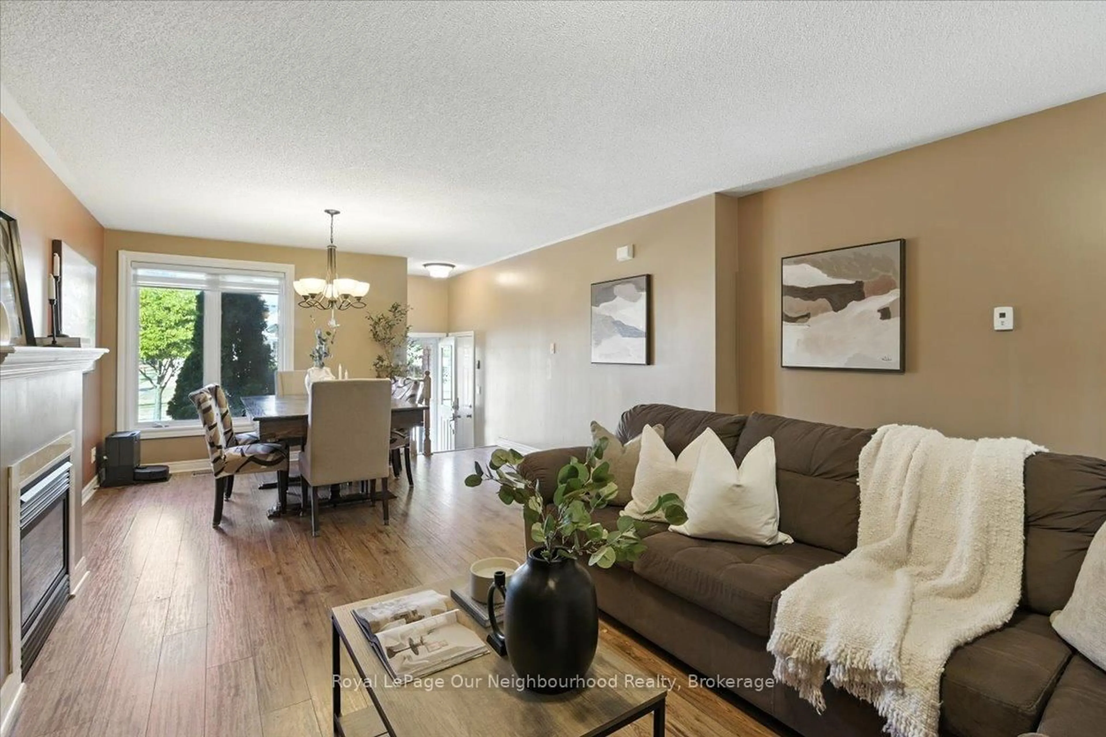 Living room with furniture, wood/laminate floor for 67 Harmer Dr, Clarington Ontario L1B 1P7