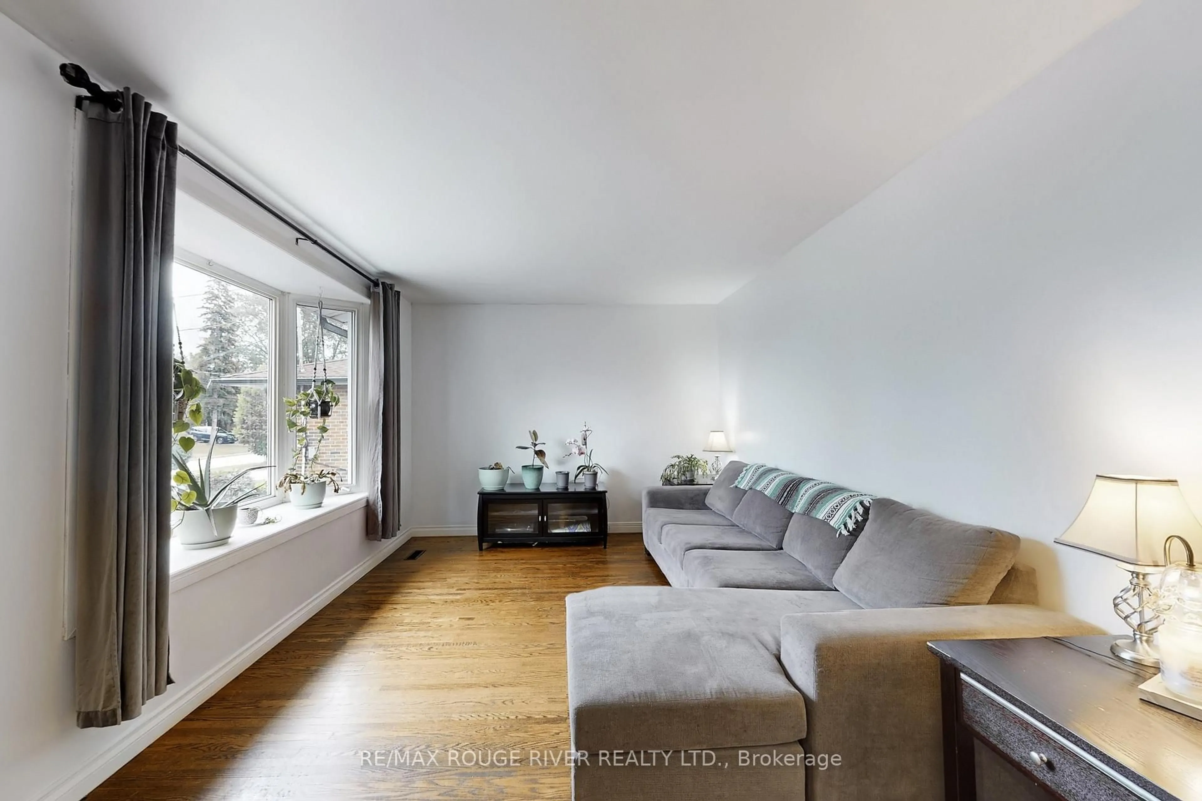 Living room with furniture, wood/laminate floor for 798 Oliva St, Pickering Ontario L1W 2V8