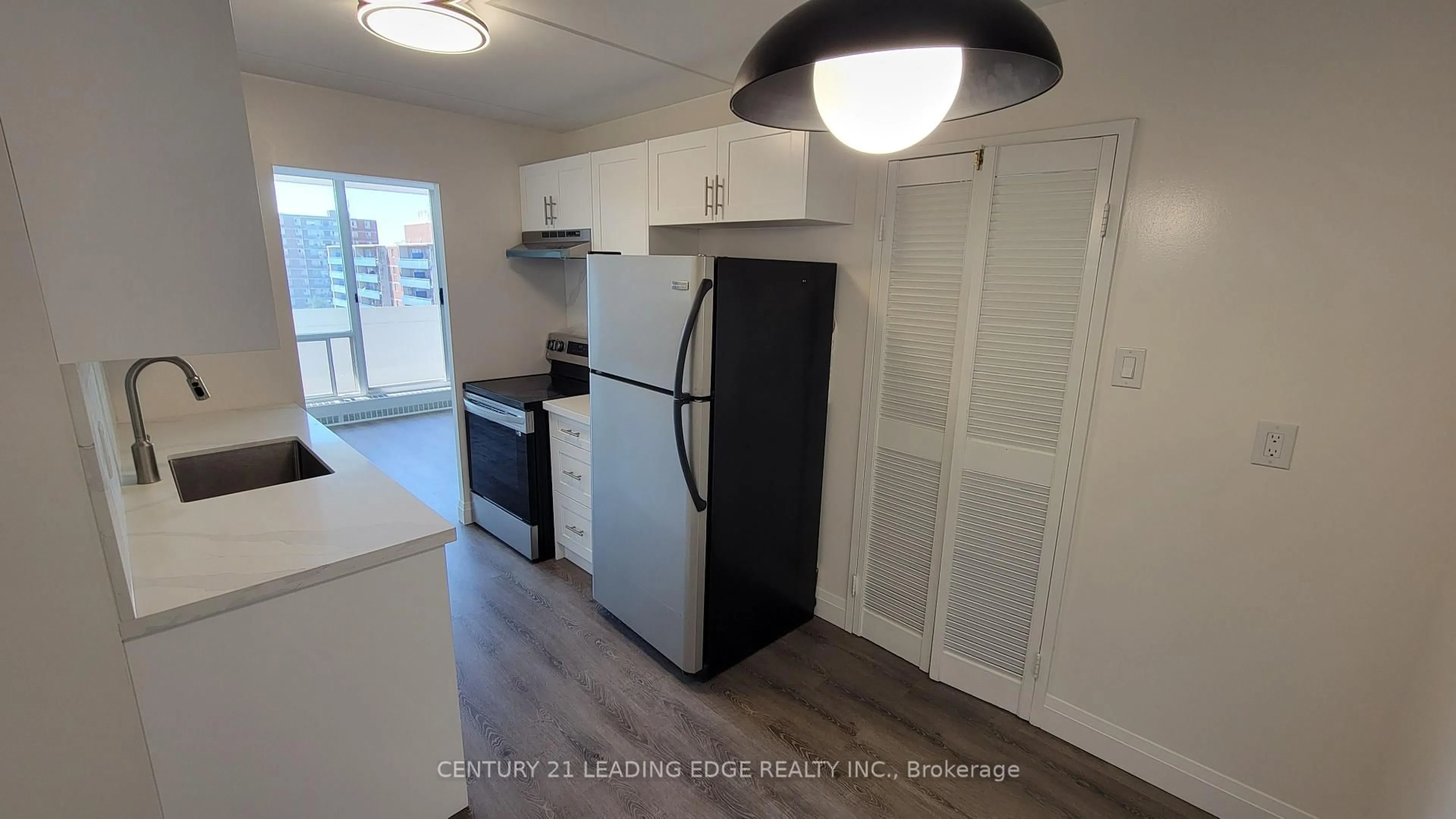 Standard kitchen, wood/laminate floor for 2 Glamorgan Ave #1005, Toronto Ontario M1P 2M8