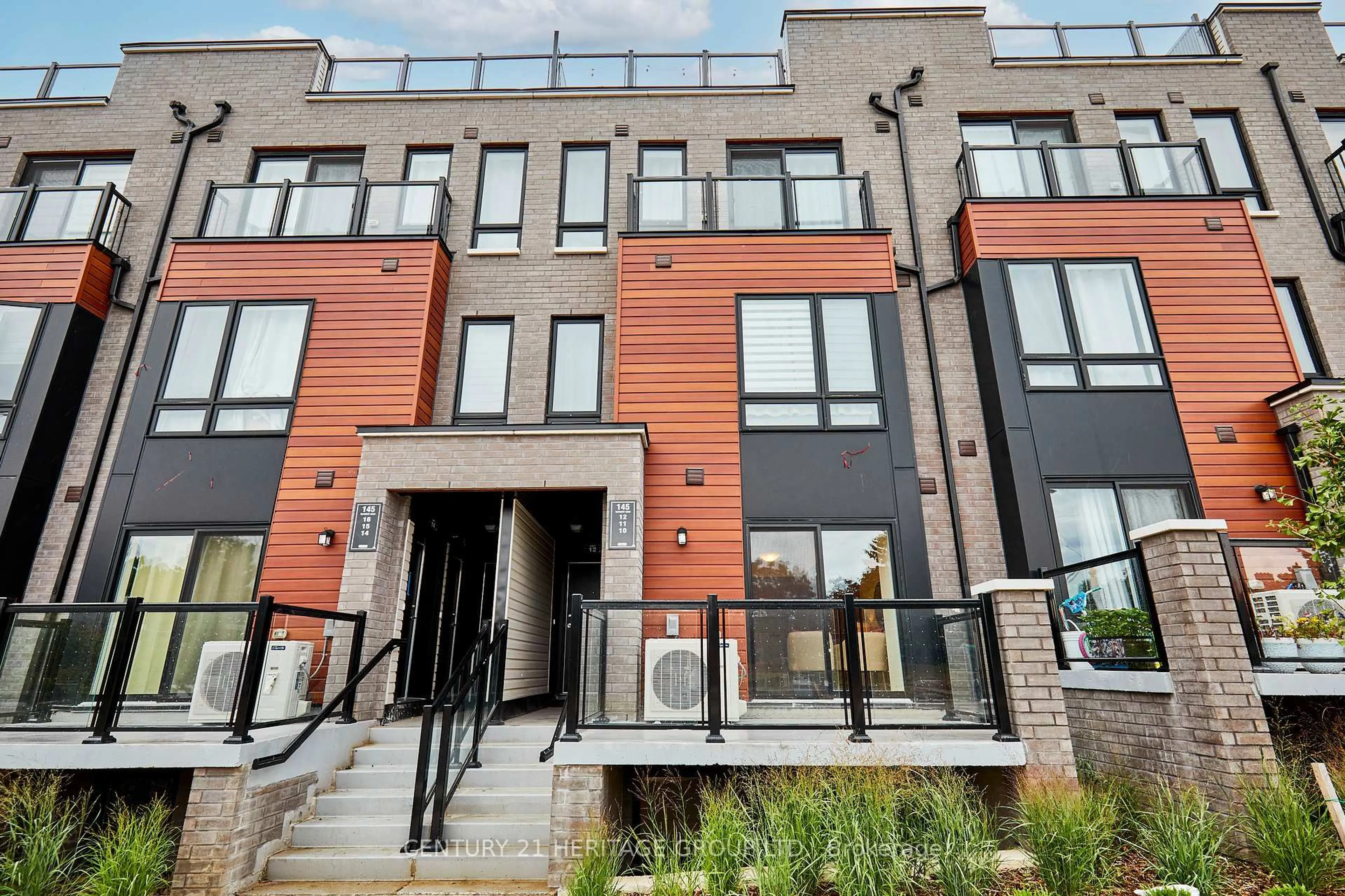Home with brick exterior material, street for 145 Tapscott Rd #10, Toronto Ontario M1B 1E7