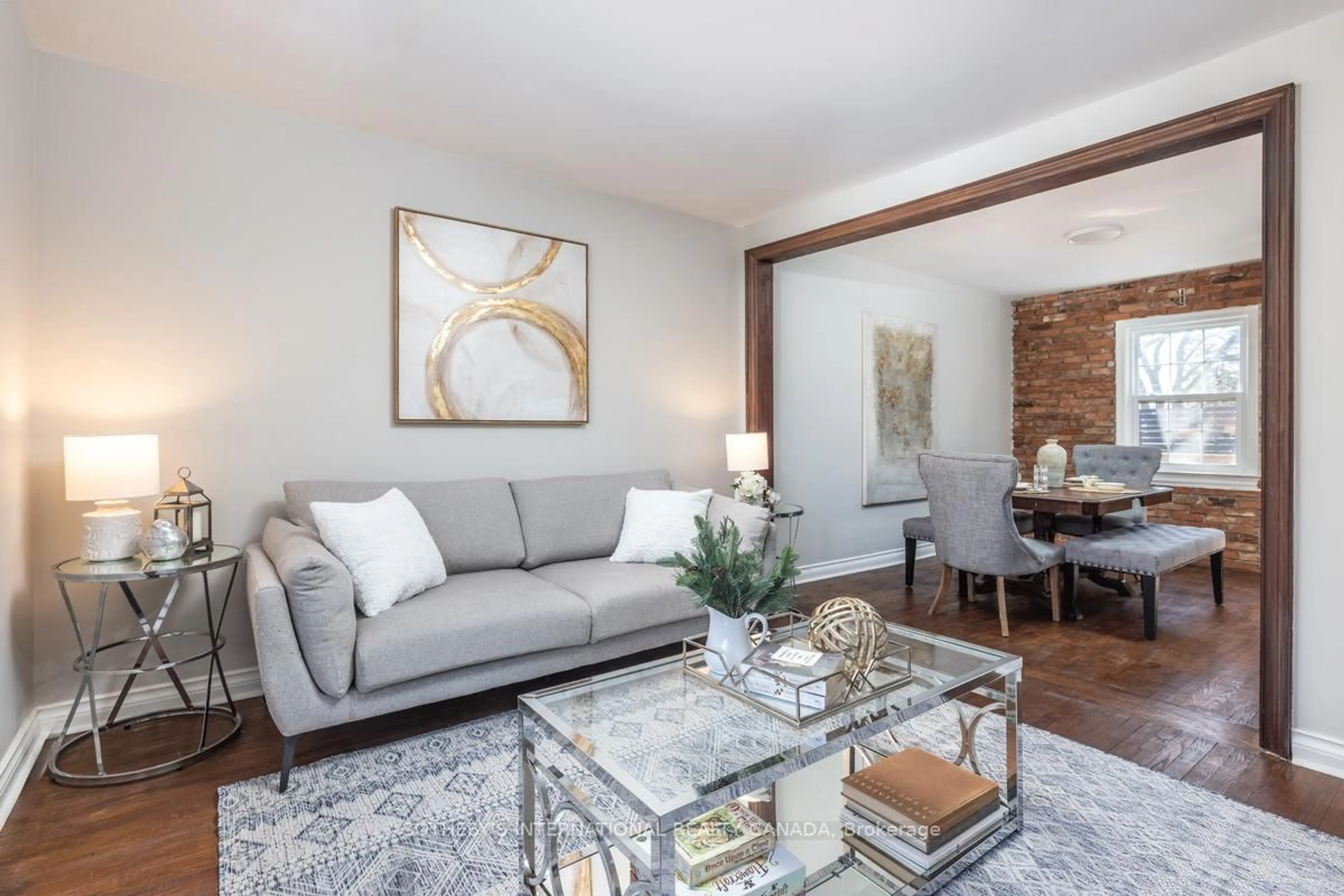 Living room with furniture, wood/laminate floor for 33 Southmead Rd, Toronto Ontario M1L 2H9