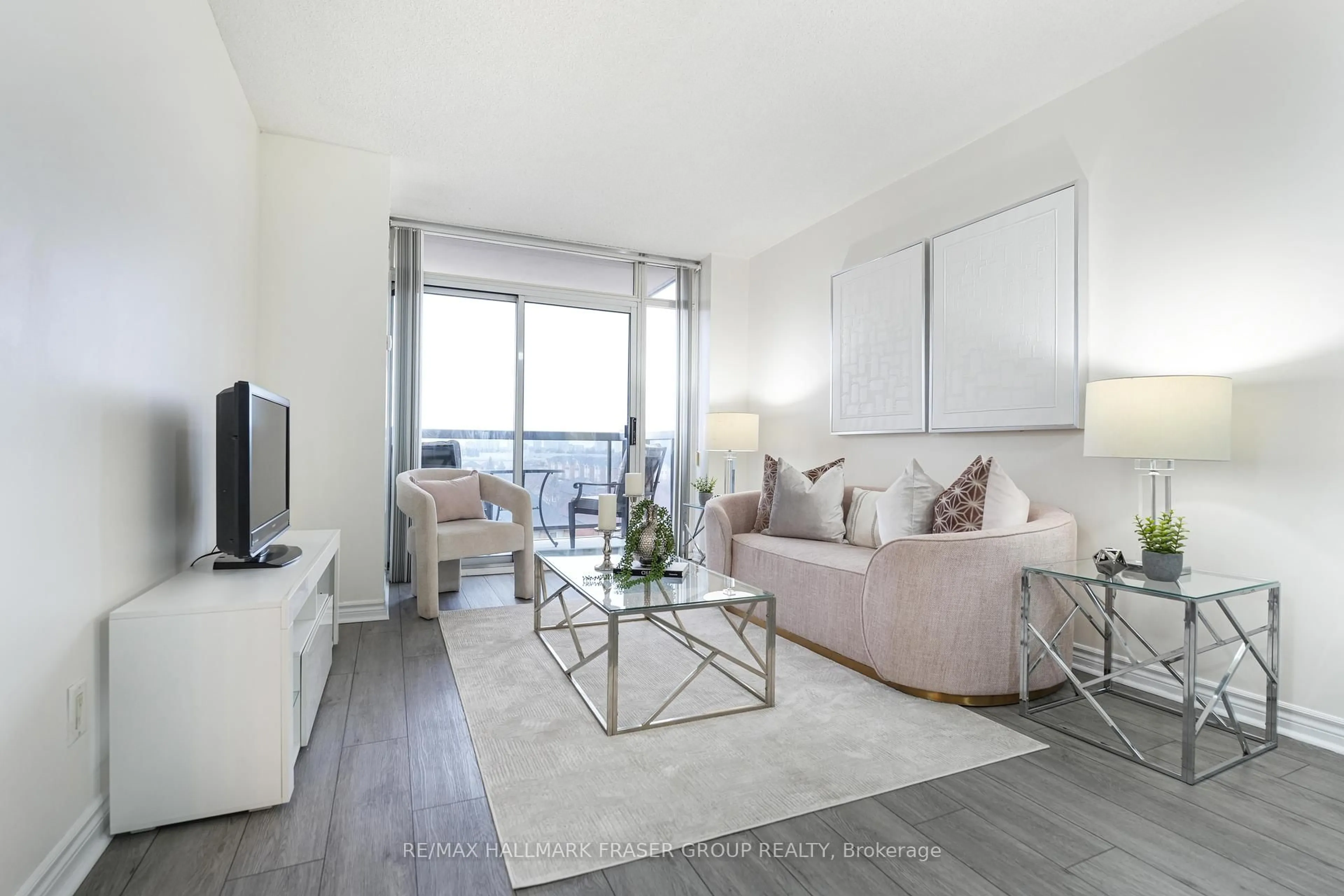 Living room with furniture, unknown for 8 Mondeo Dr #512, Toronto Ontario M1P 5C7