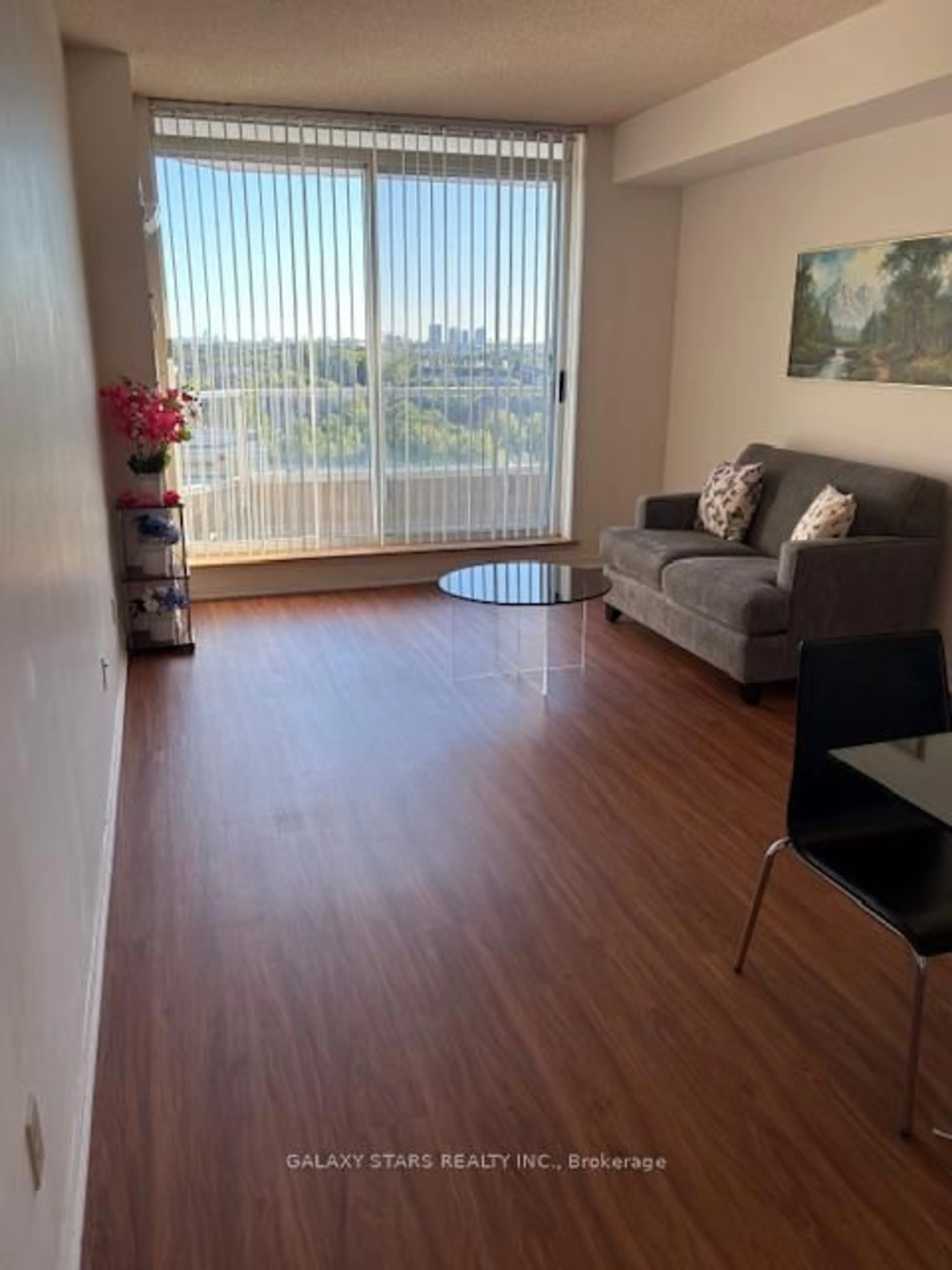Living room with furniture, wood/laminate floor for 400 Mclevin Ave #1012, Toronto Ontario M1B 5J4