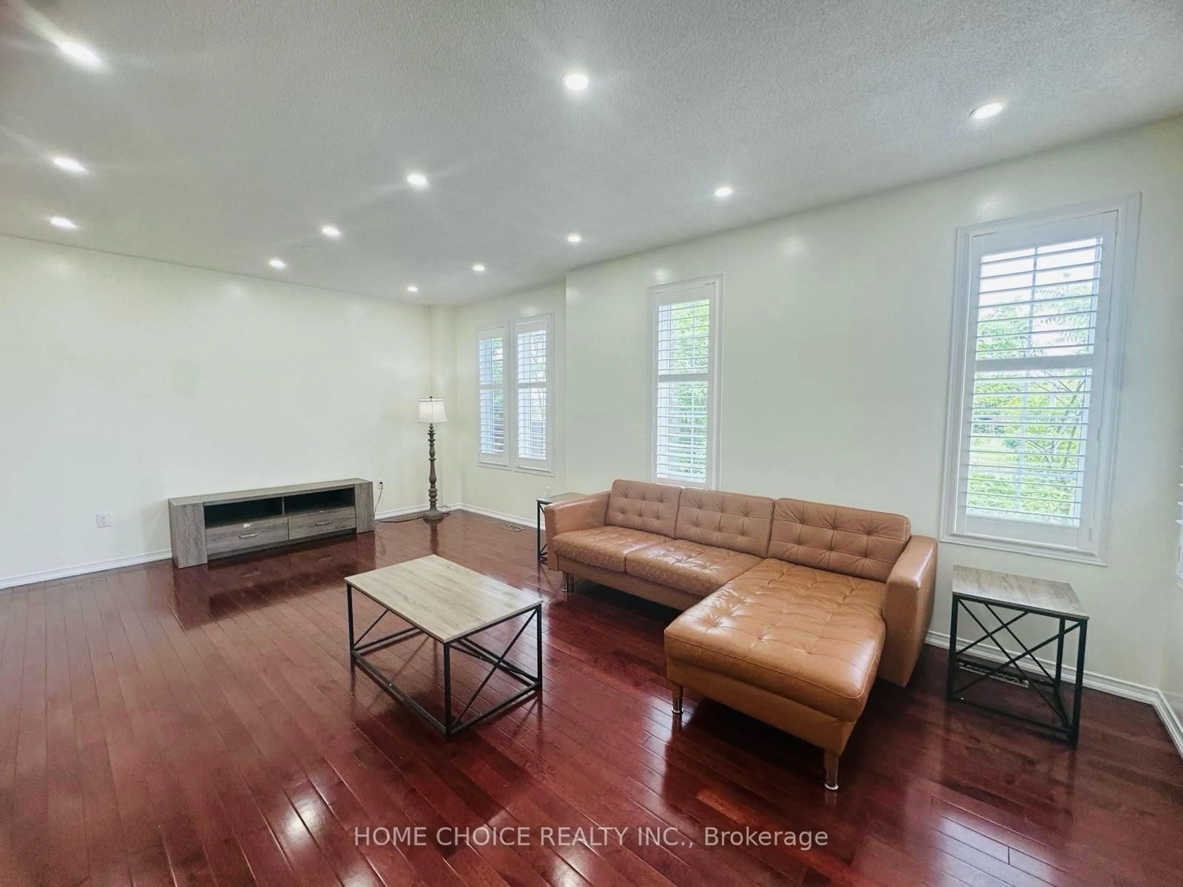 Living room with furniture, wood/laminate floor for 1773 Badgley Dr Dr, Oshawa Ontario L1K 0H5