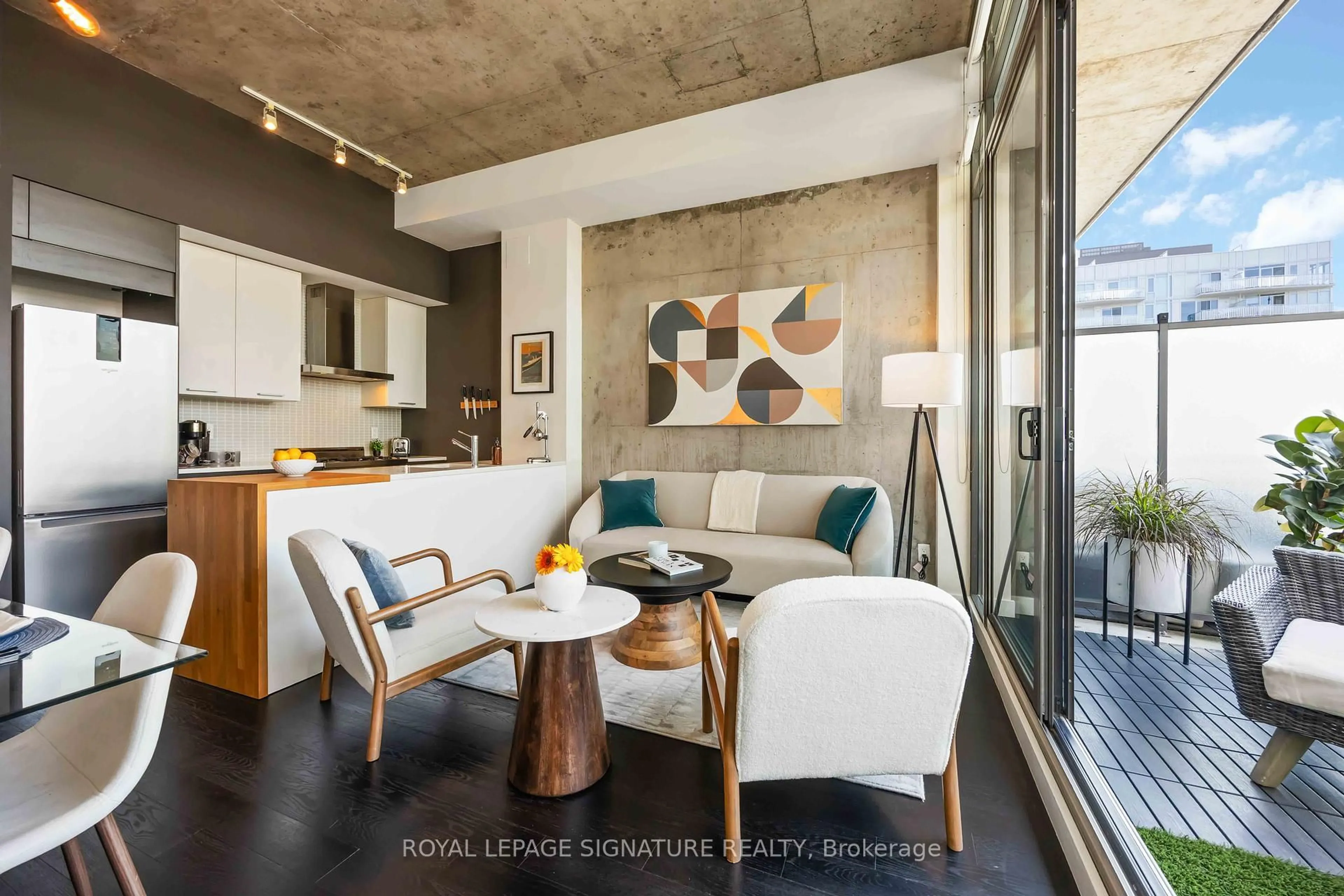 Living room with furniture, cement floor for 90 Broadview Ave #913, Toronto Ontario M4M 0A7