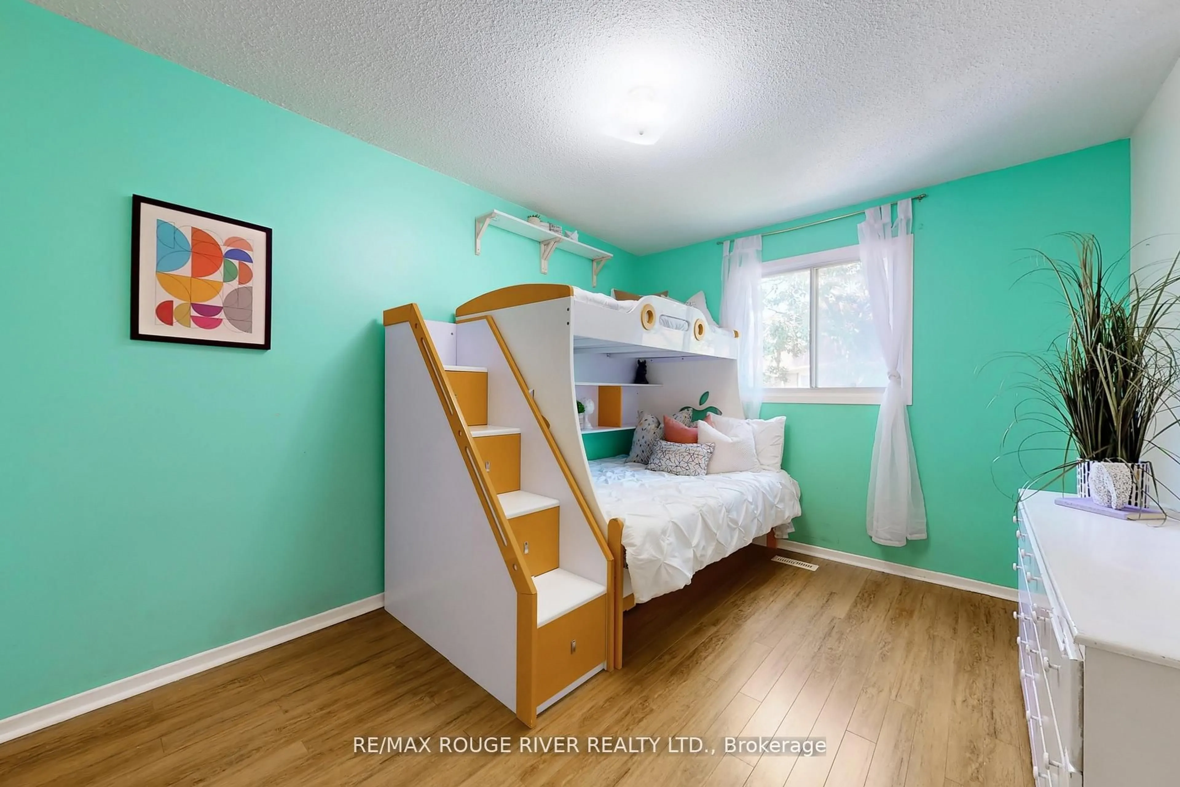 Bedroom with bed, wood/laminate floor for 34 Dundalk Dr #24, Toronto Ontario M1P 4W3