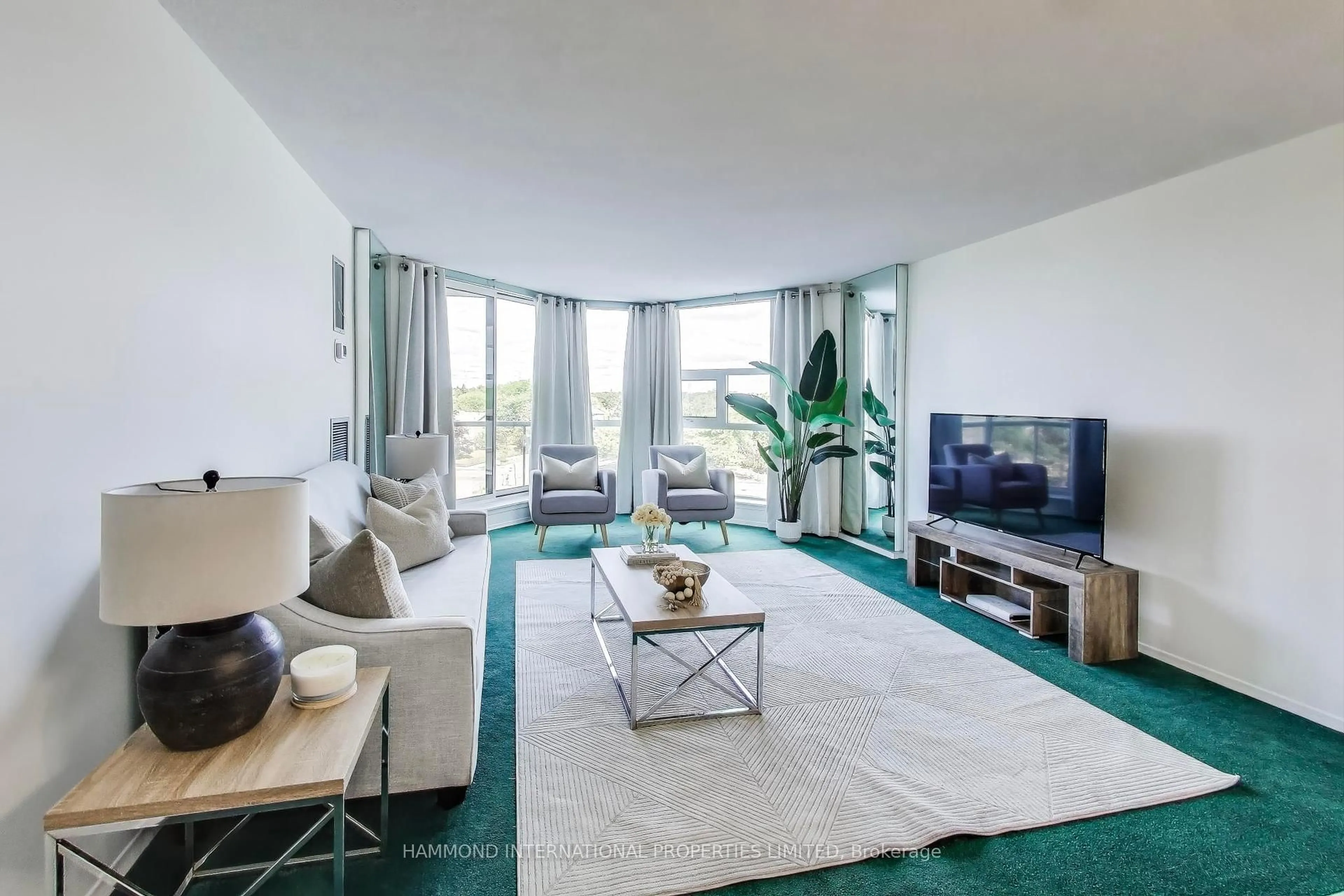 Living room with furniture, carpet floor for 10 Dean Park Rd #416, Toronto Ontario M1B 3G8