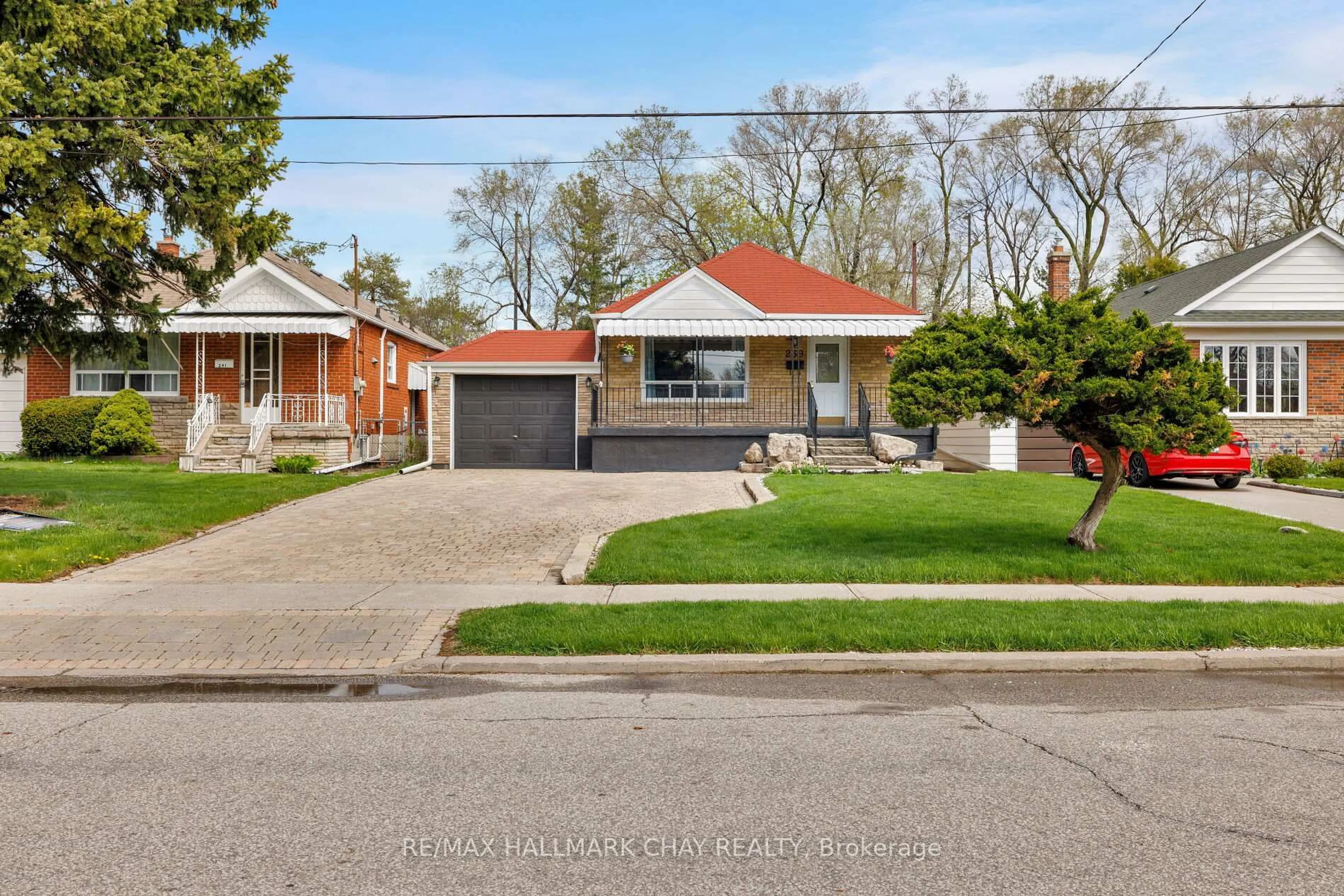 Home with brick exterior material, street for 239 Ellington Dr, Toronto Ontario M1R 3Y2