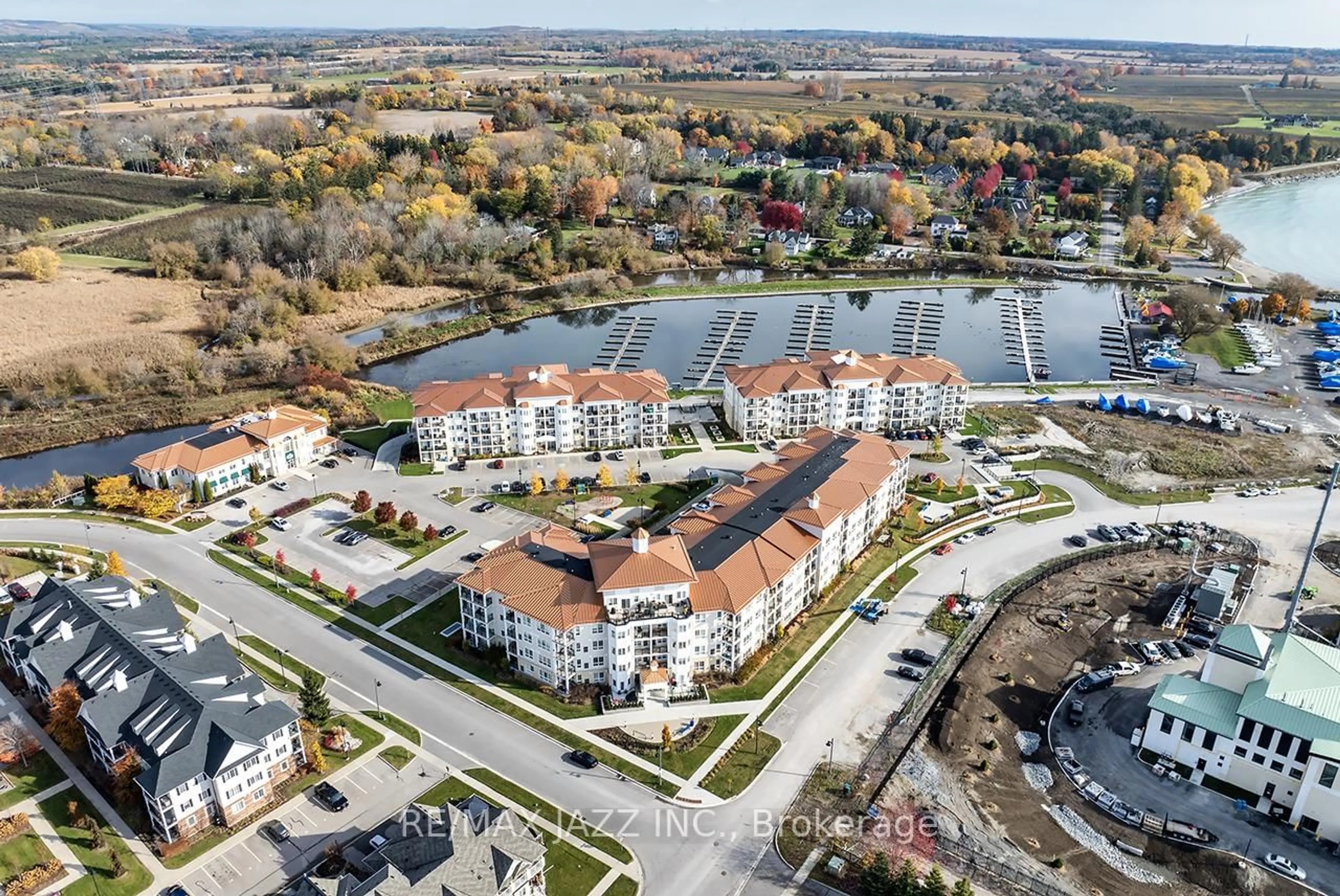 A pic from outside/outdoor area/front of a property/back of a property/a pic from drone, water/lake/river/ocean view for 50 Lakebreeze Dr #126, Clarington Ontario L1B 0V9