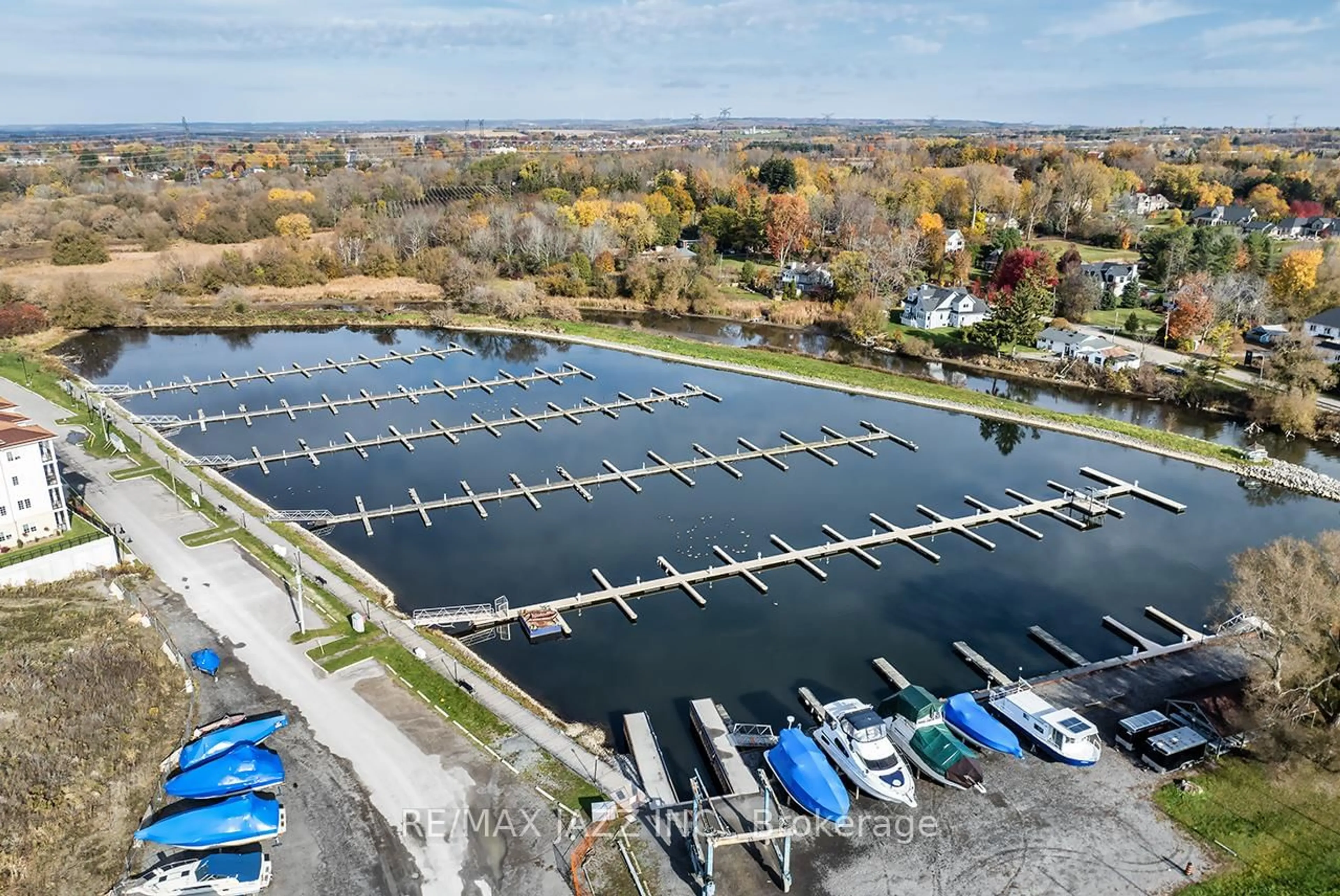 A pic from outside/outdoor area/front of a property/back of a property/a pic from drone, water/lake/river/ocean view for 50 Lakebreeze Dr #126, Clarington Ontario L1B 0V9
