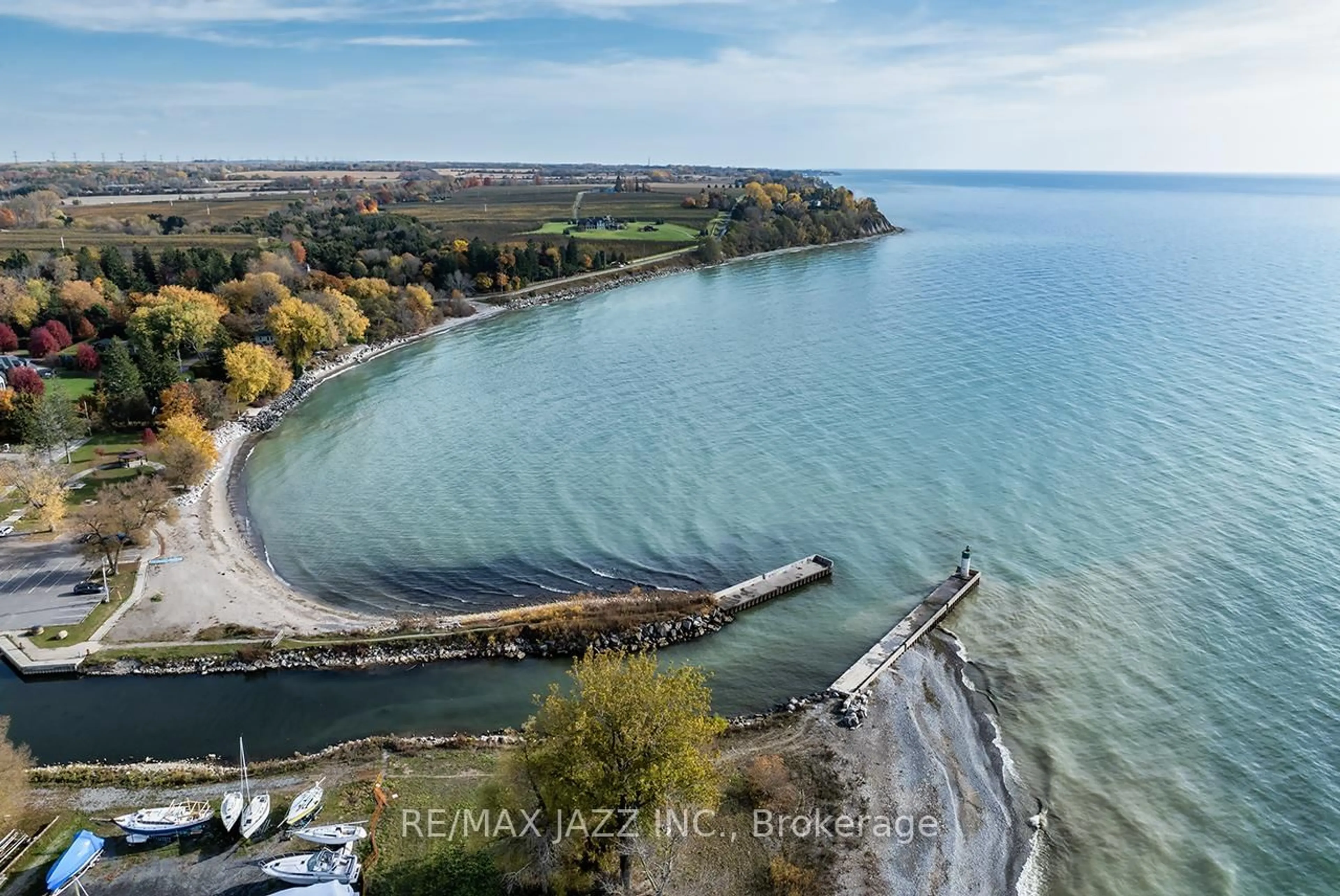 A pic from outside/outdoor area/front of a property/back of a property/a pic from drone, water/lake/river/ocean view for 50 Lakebreeze Dr #126, Clarington Ontario L1B 0V9