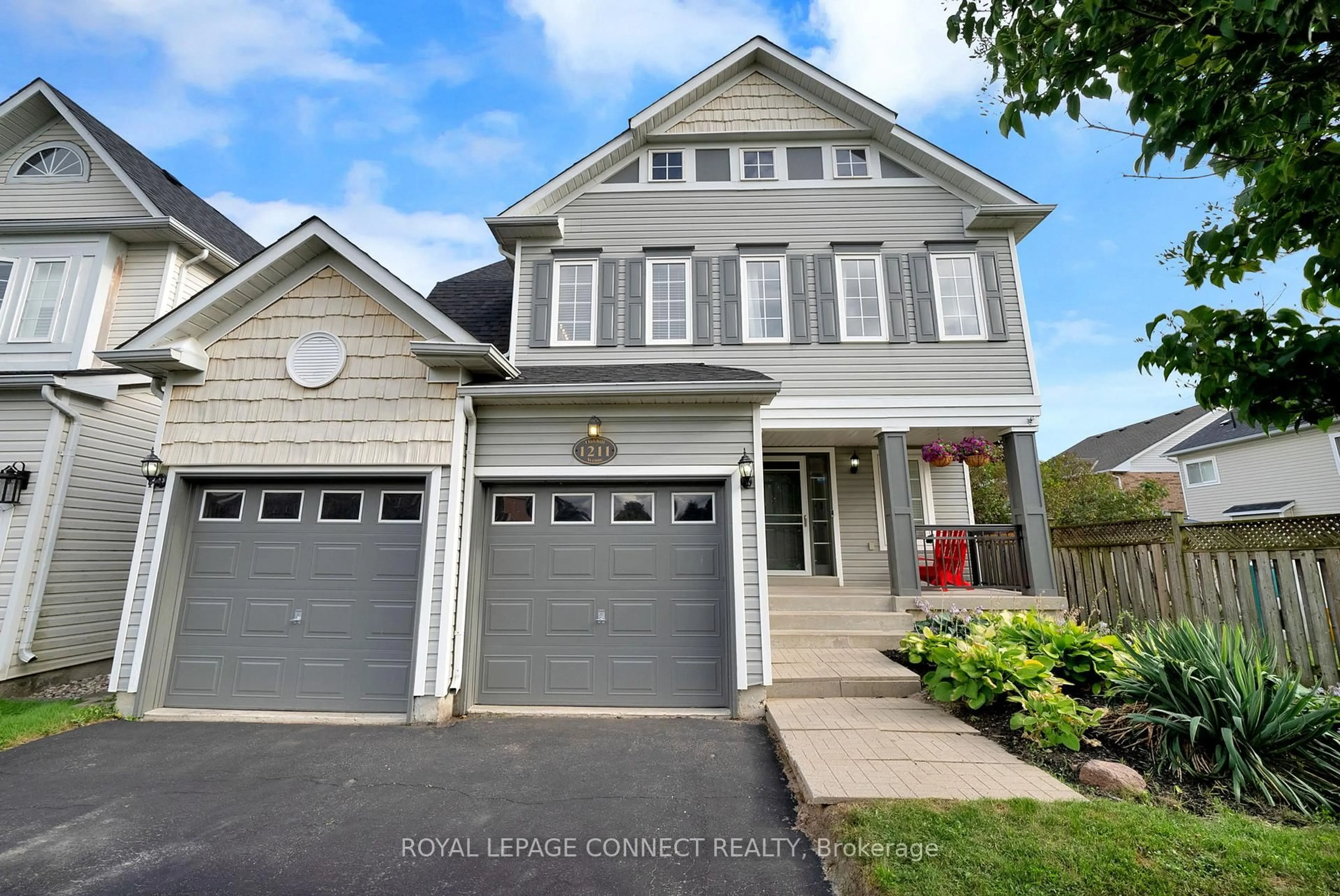 Home with vinyl exterior material, street for 1211 Oakhill Ave, Oshawa Ontario L1K 2R4