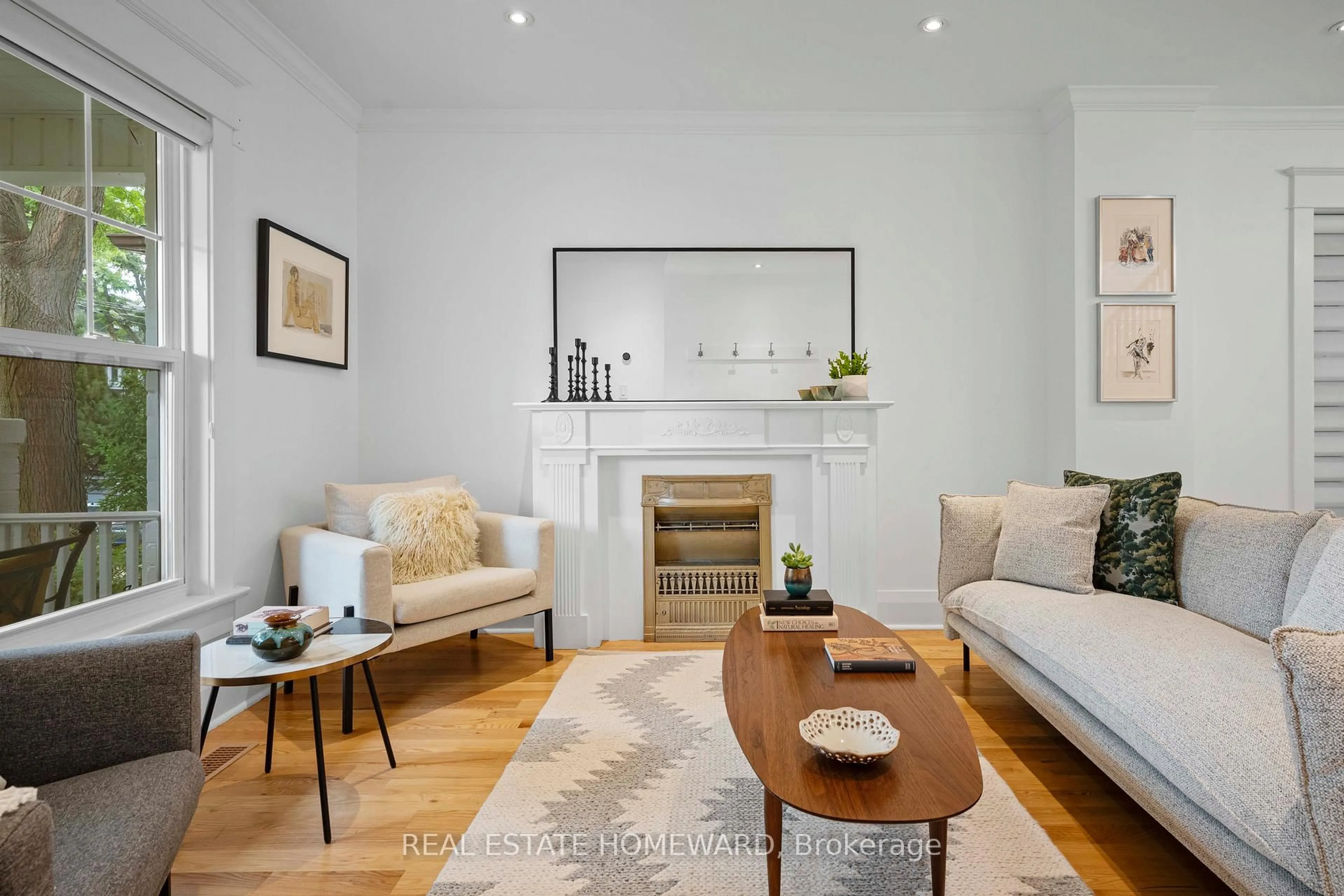 Living room with furniture, wood/laminate floor for 158 Hastings Ave, Toronto Ontario M4L 2L4
