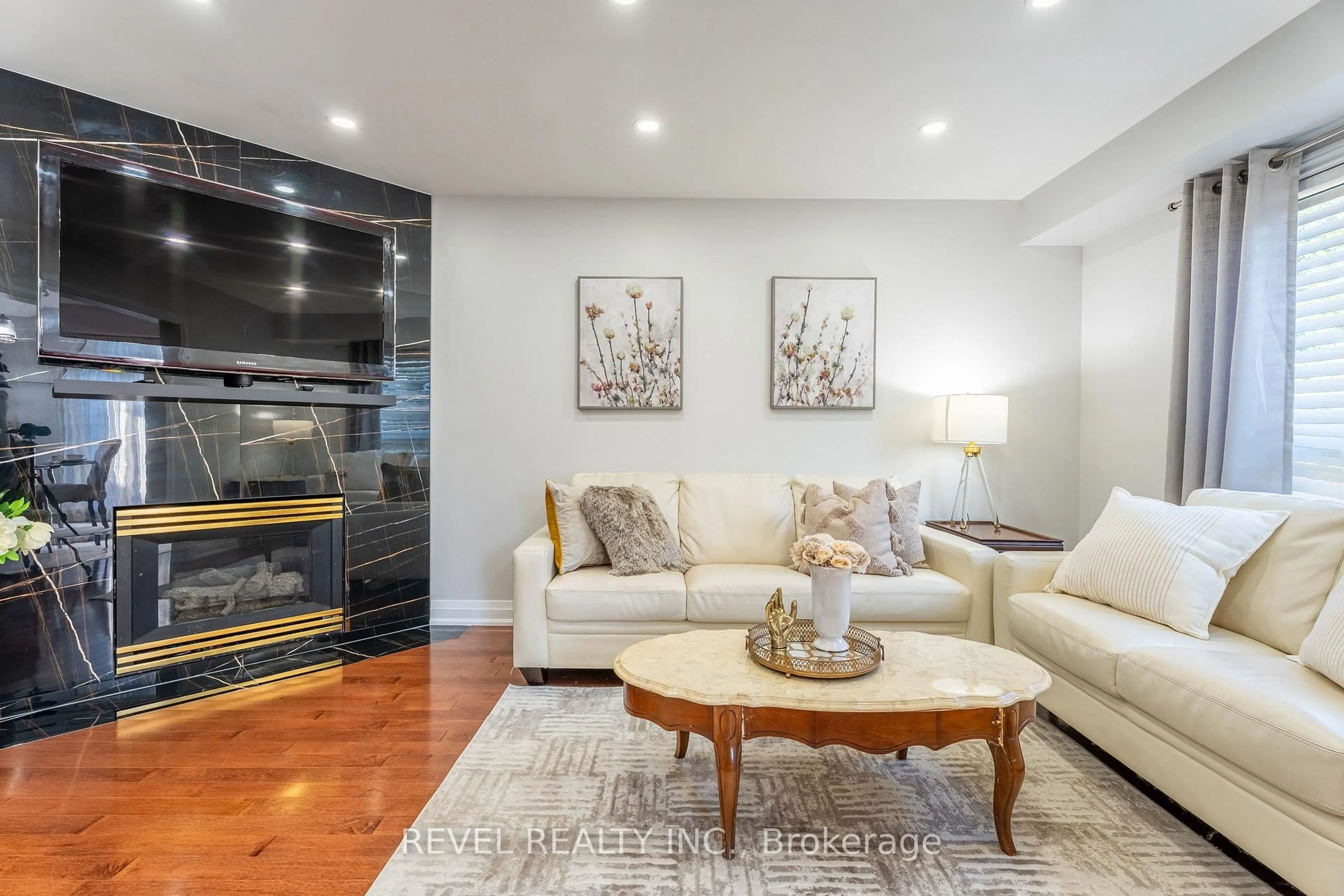 Living room with furniture, wood/laminate floor for 117 Apple Blossom Blvd, Clarington Ontario L1C 4T8