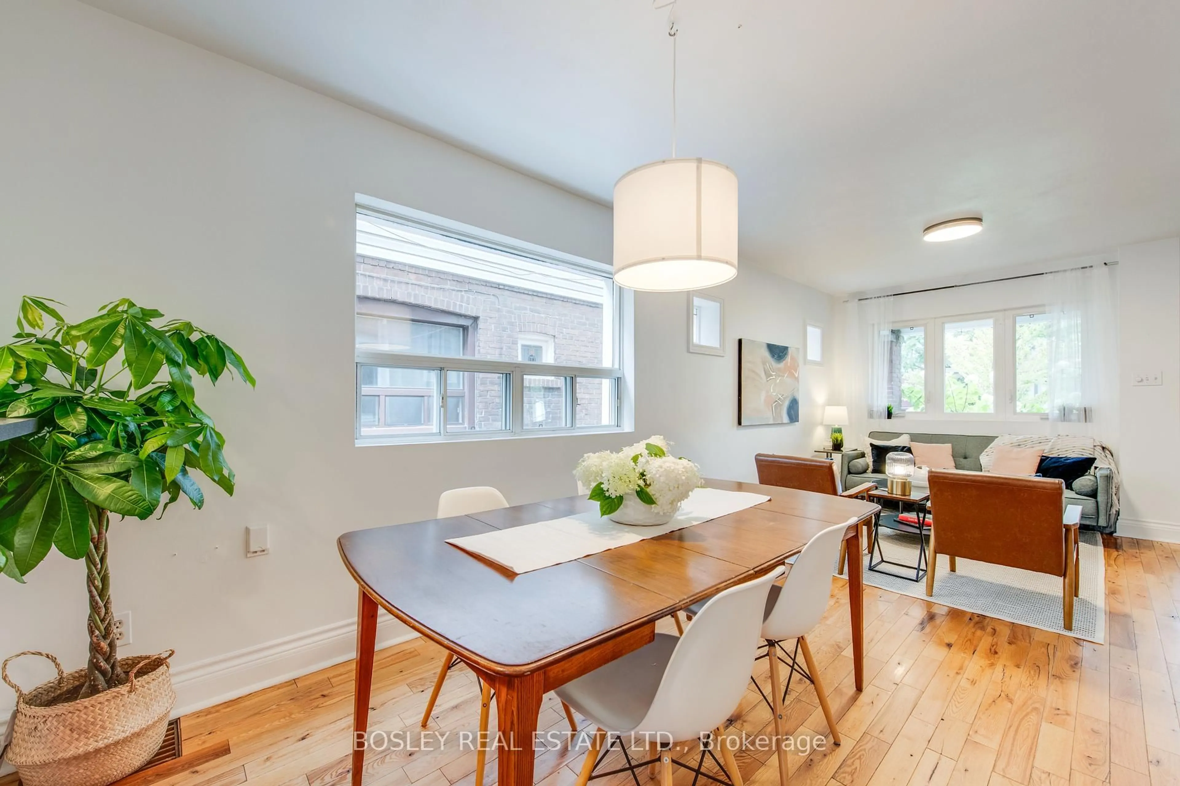 Dining room, wood/laminate floor for 55 Robbins Ave, Toronto Ontario M4L 1X1