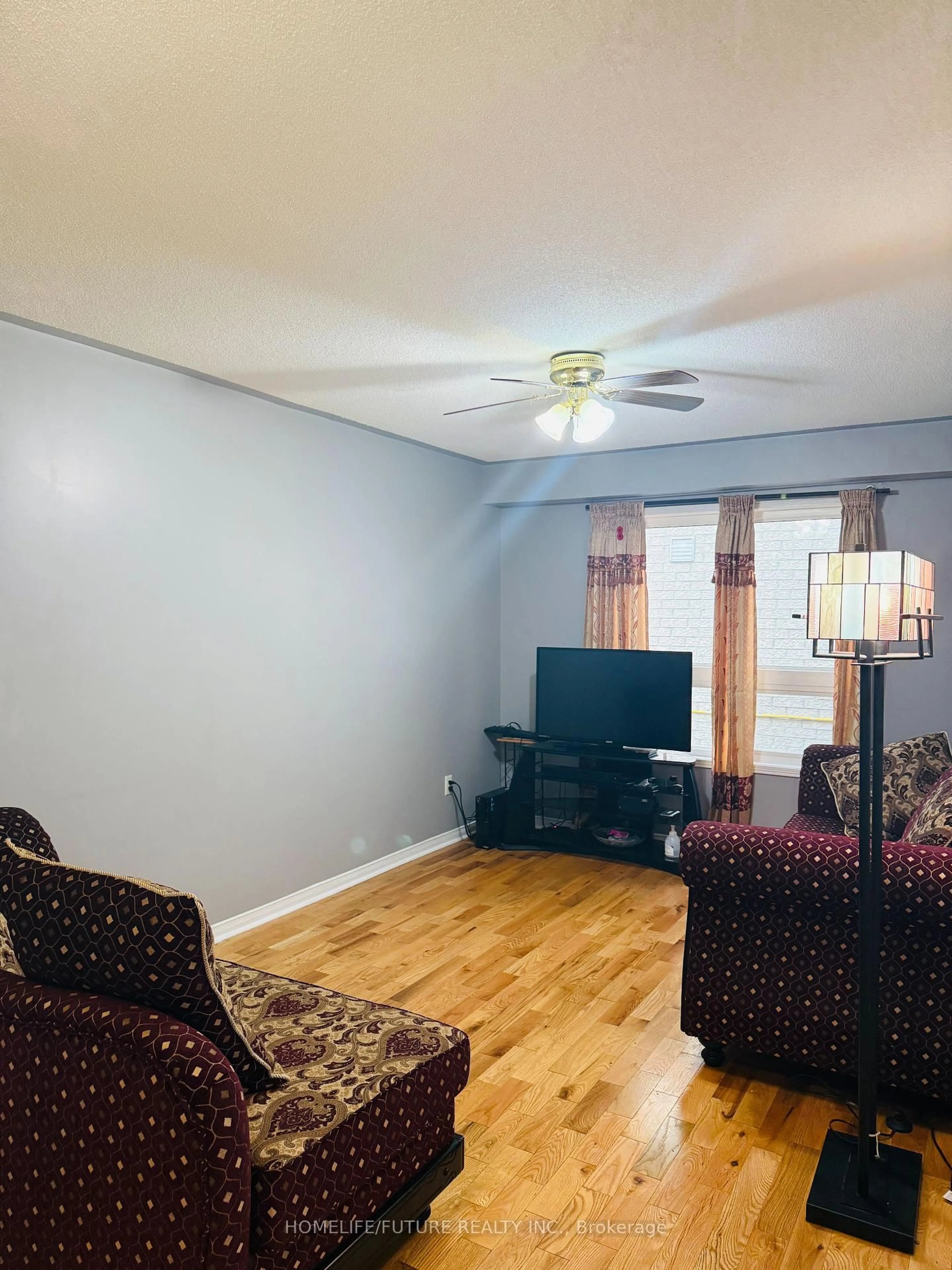 Living room with furniture, wood/laminate floor for 648 Blackwood Blvd, Oshawa Ontario L1K 0G7