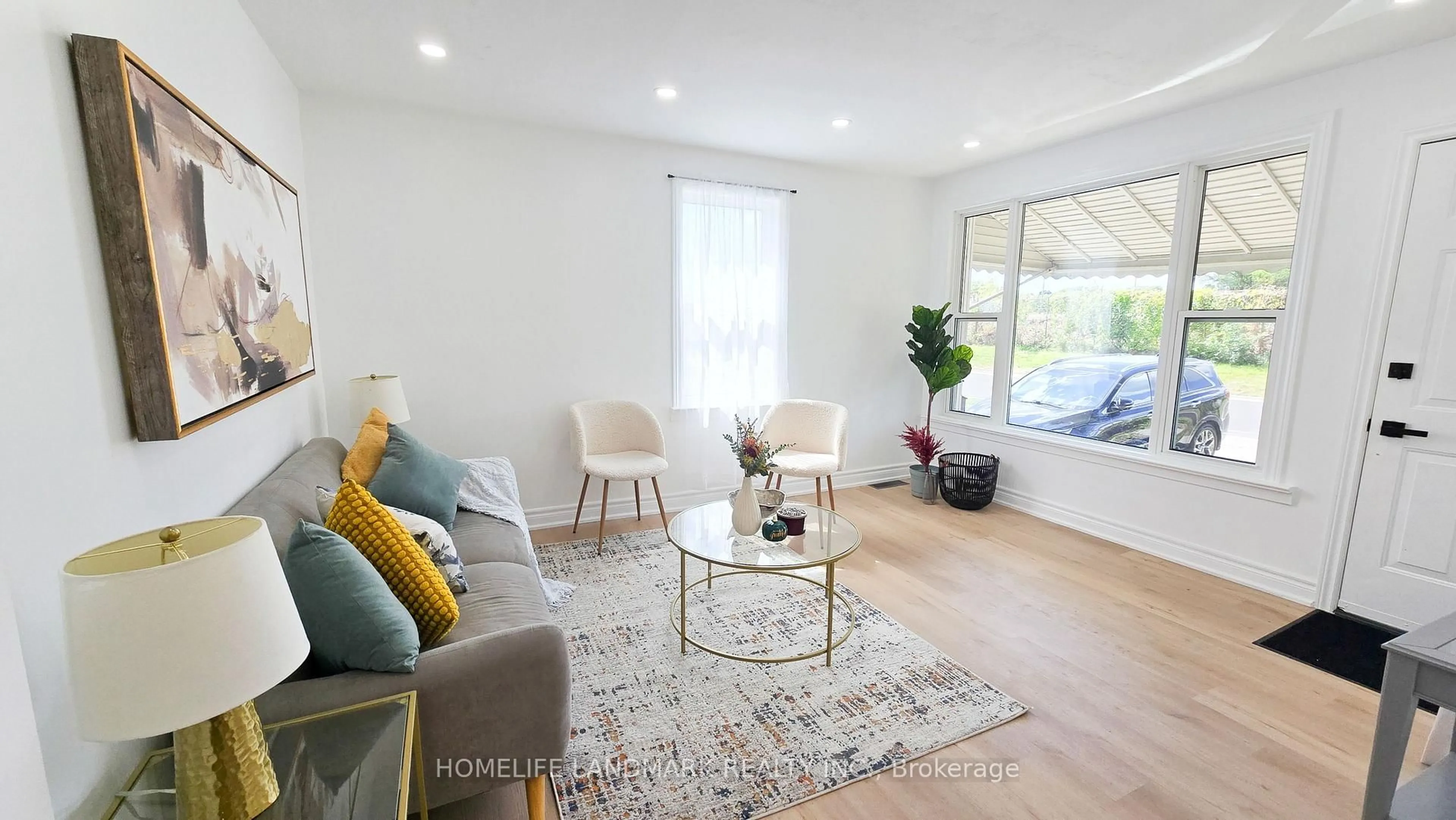 Living room with furniture, wood/laminate floor for 357 Oshawa Blvd, Oshawa Ontario L1G 5T2