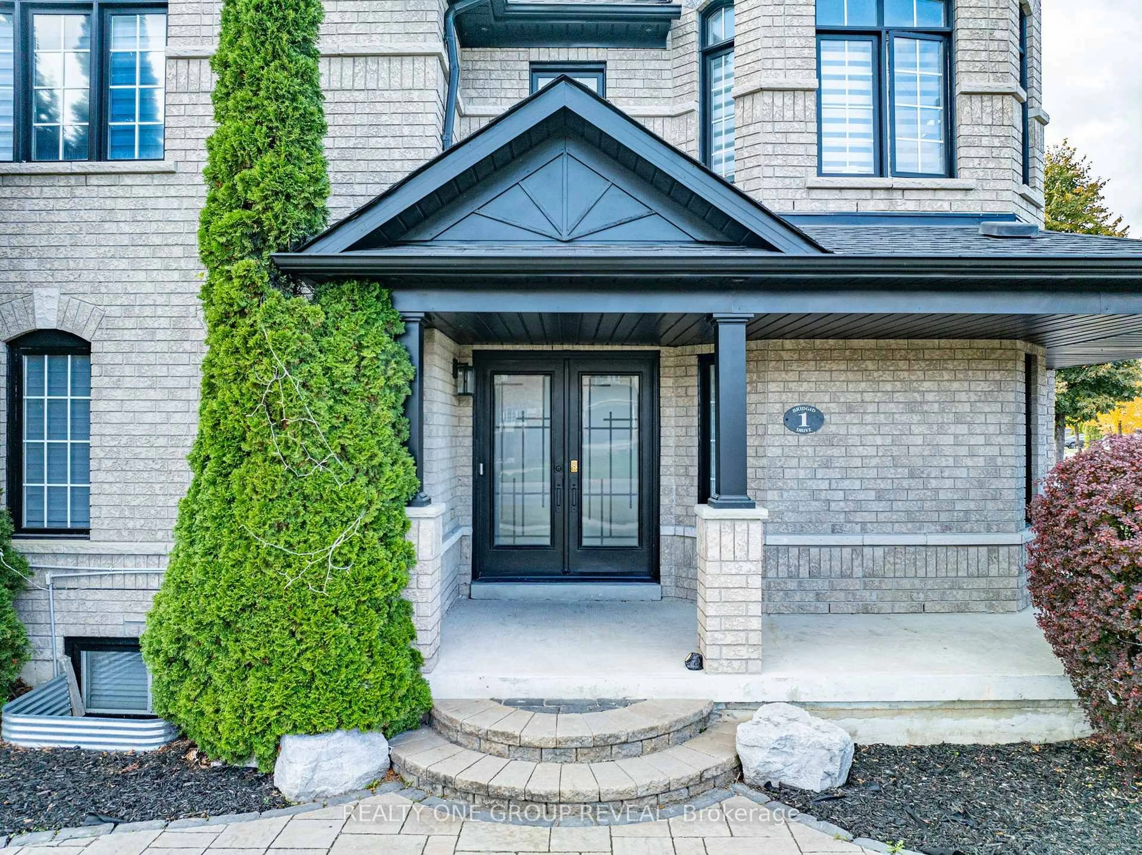Home with brick exterior material, street for 1 Bridgid Dr, Whitby Ontario L1P 1T7