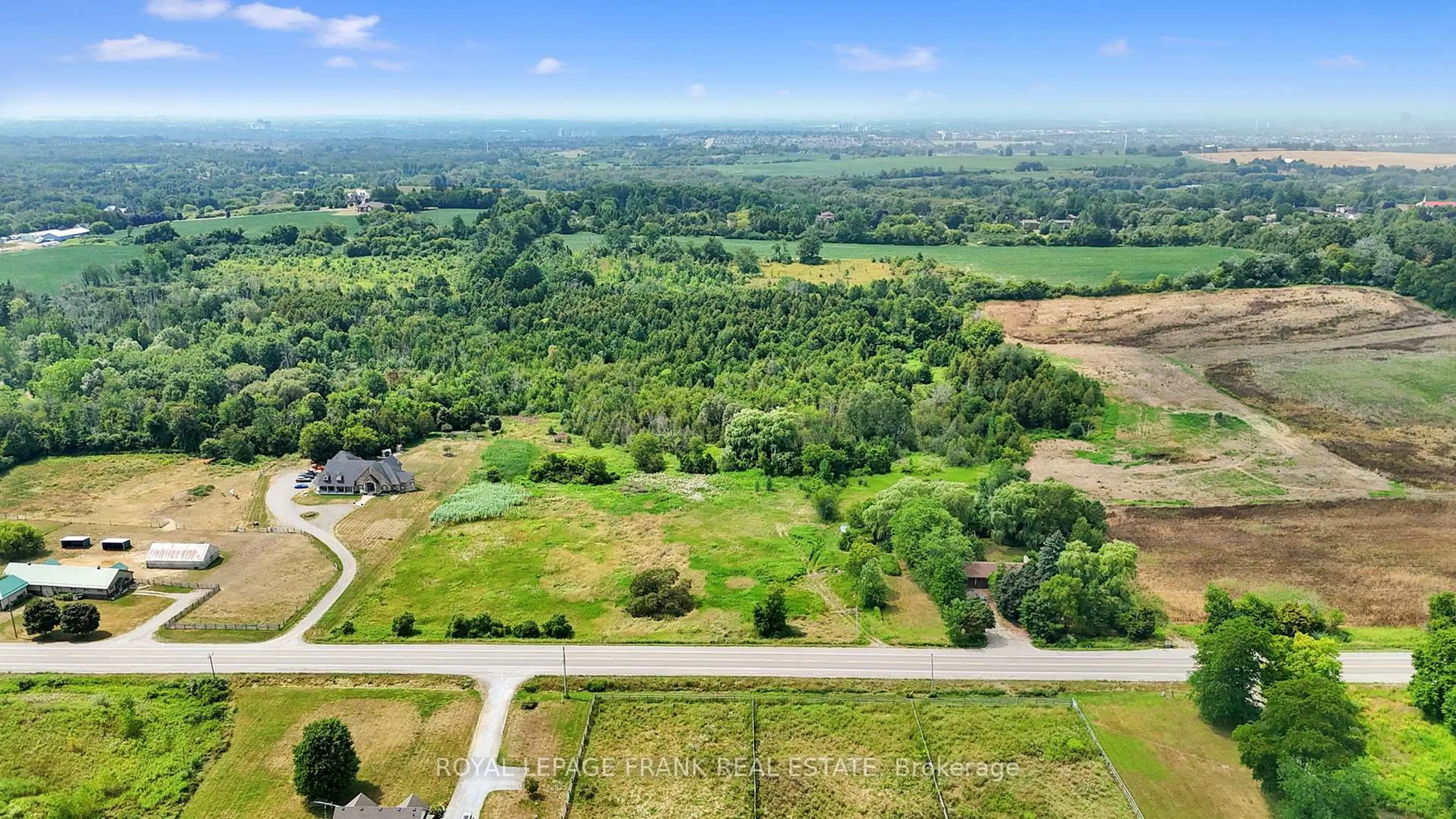 A pic from outside/outdoor area/front of a property/back of a property/a pic from drone, forest/trees view for 4538 Courtice Rd, Clarington Ontario L0B 1J0