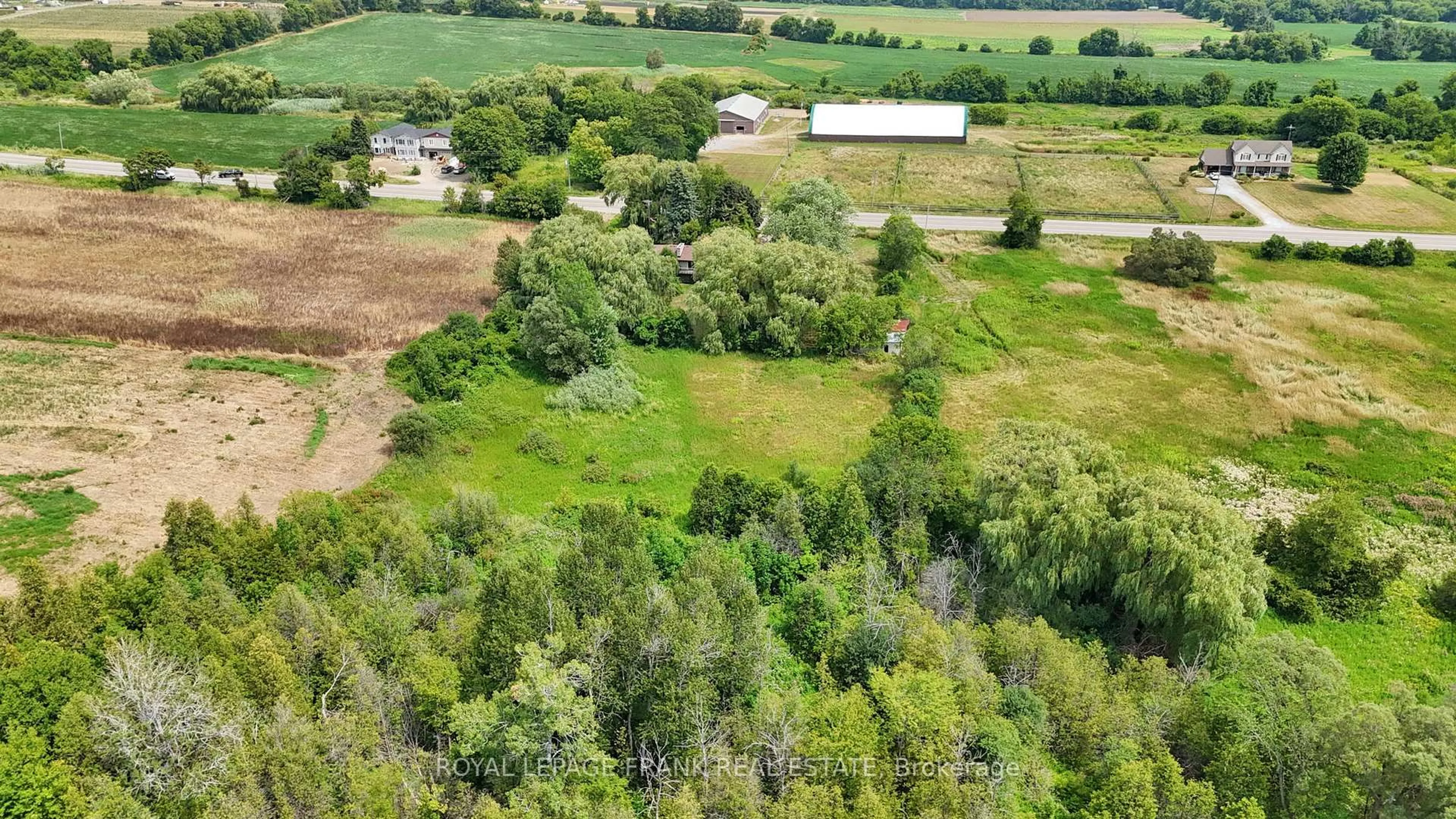 A pic from outside/outdoor area/front of a property/back of a property/a pic from drone, forest/trees view for 4538 Courtice Rd, Clarington Ontario L0B 1J0