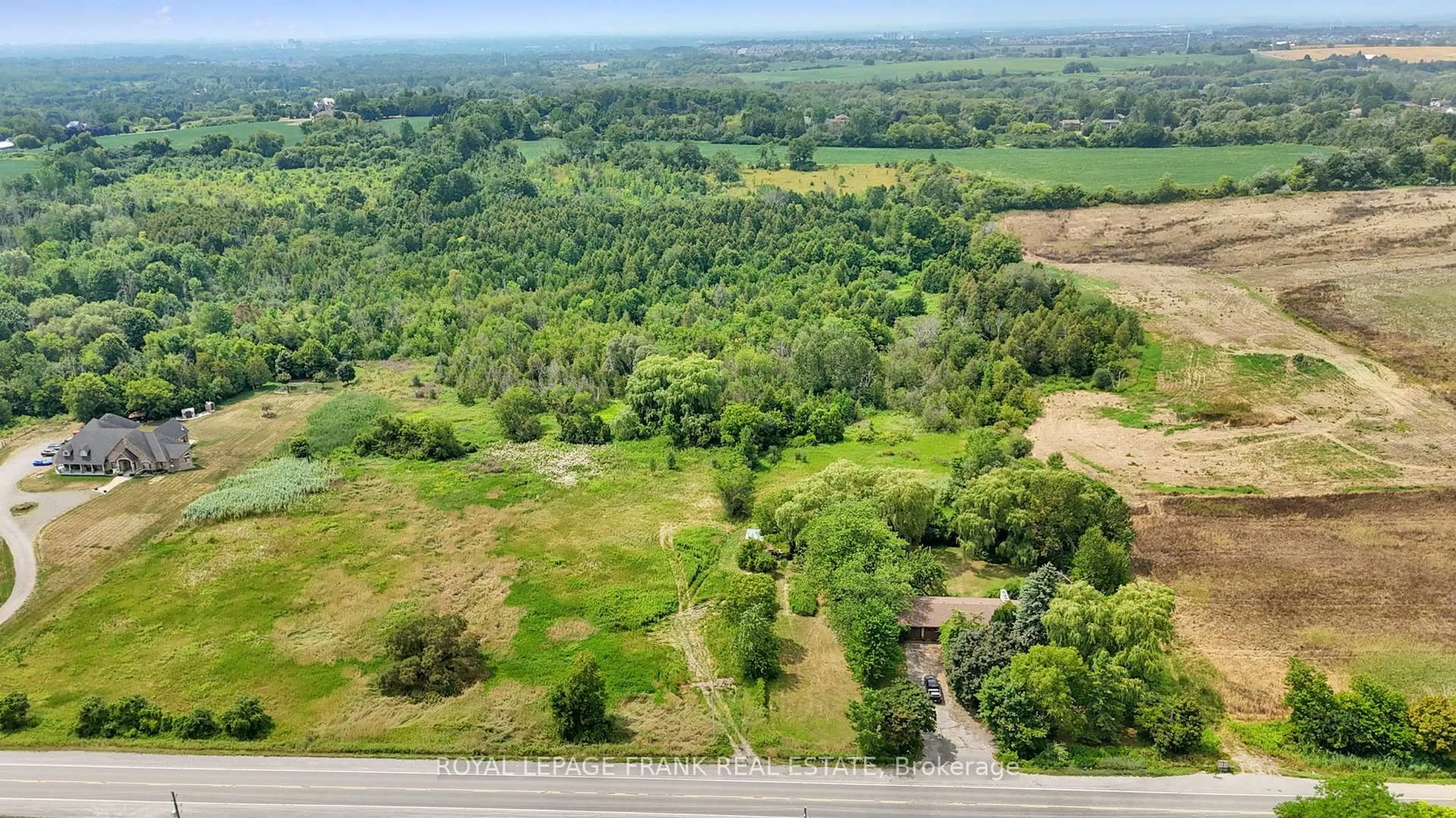 A pic from outside/outdoor area/front of a property/back of a property/a pic from drone, forest/trees view for 4538 Courtice Rd, Clarington Ontario L0B 1J0