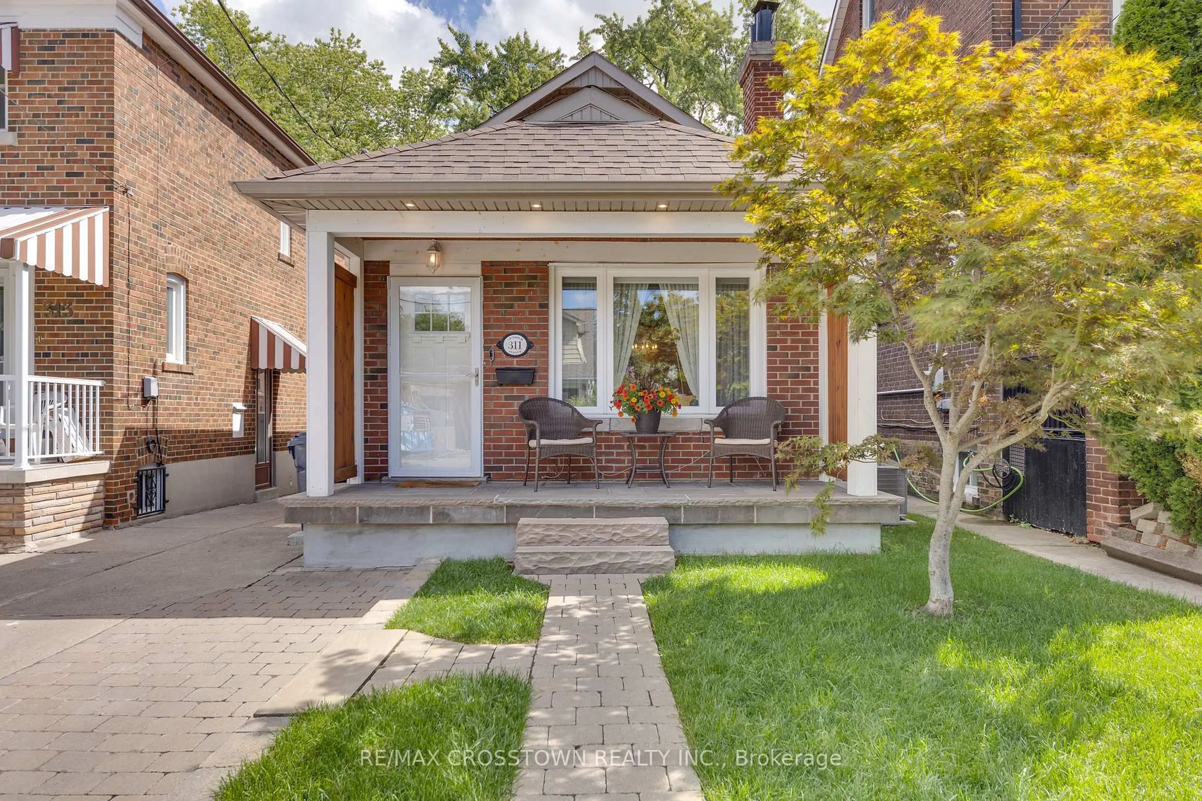 Home with brick exterior material, street for 311 Chisholm Ave, Toronto Ontario M4C 4W5