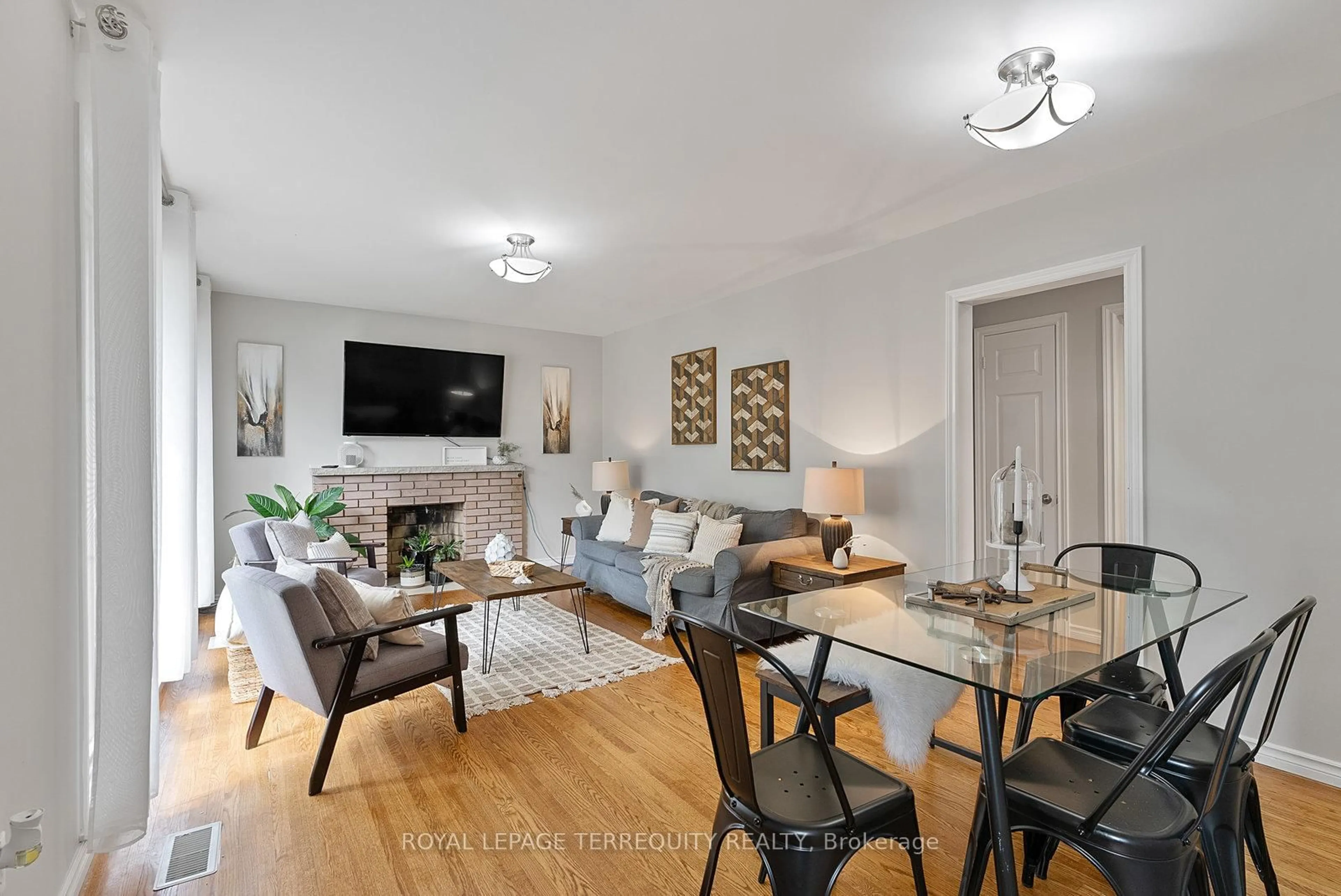 Living room with furniture, wood/laminate floor for 329 Cochrane St, Whitby Ontario L1N 5J4