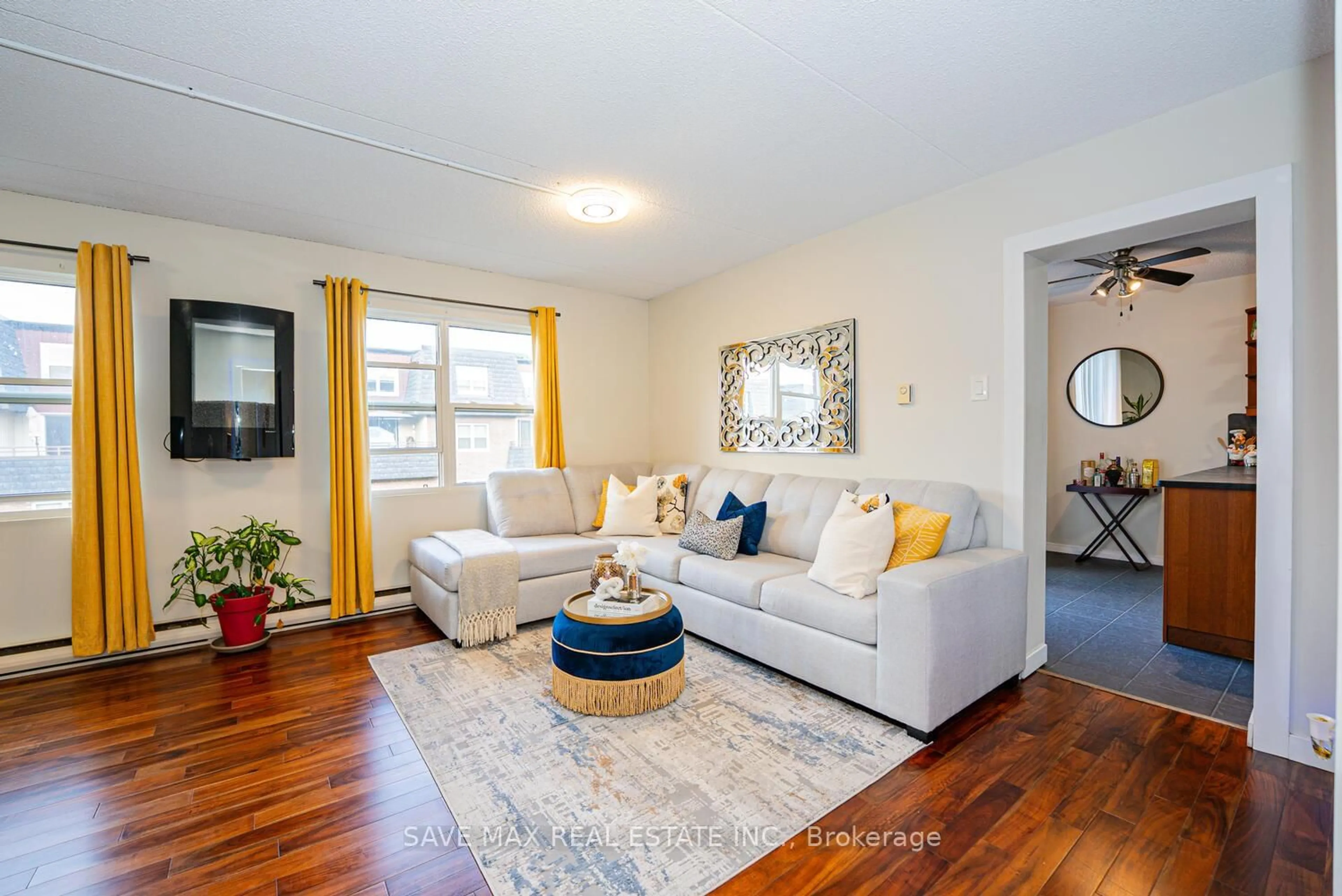 Living room with furniture, wood/laminate floor for 580 Mary St #214, Whitby Ontario L1N 2R3