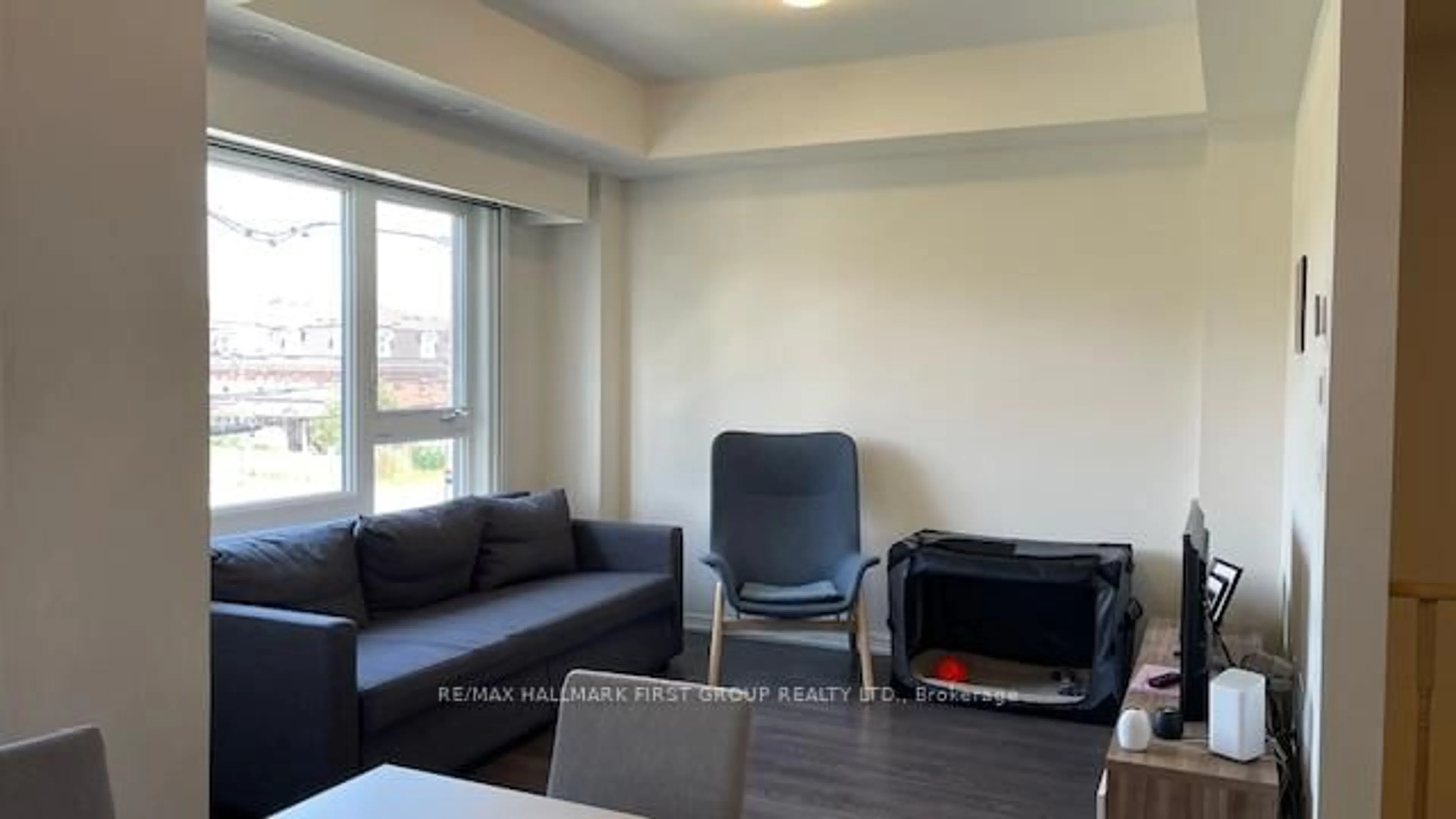 Living room with furniture, wood/laminate floor for 8835 Sheppard Ave #319, Toronto Ontario M1B 5R7