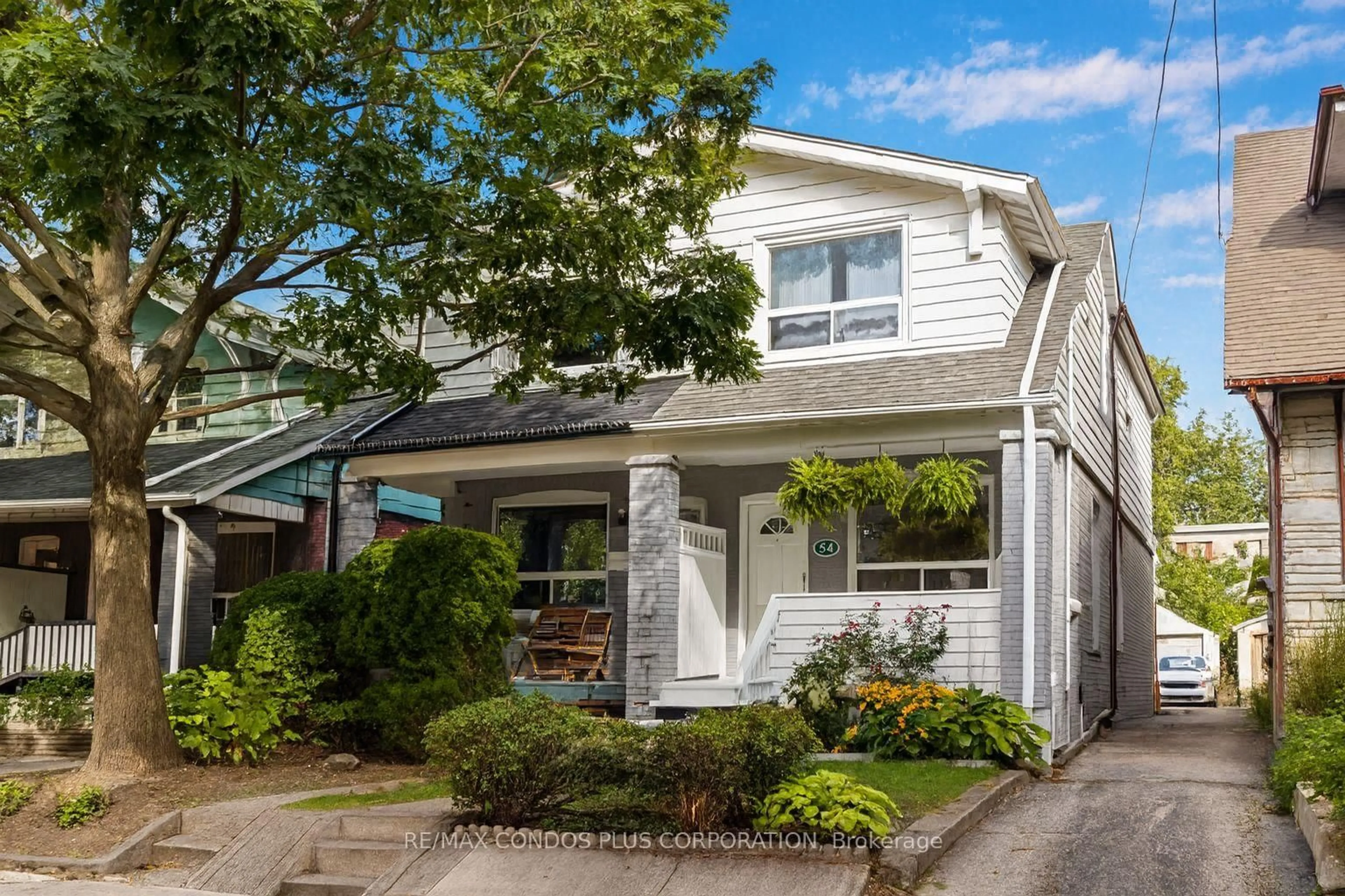 Home with vinyl exterior material, street for 54 Robbins Ave, Toronto Ontario M4L 1X2