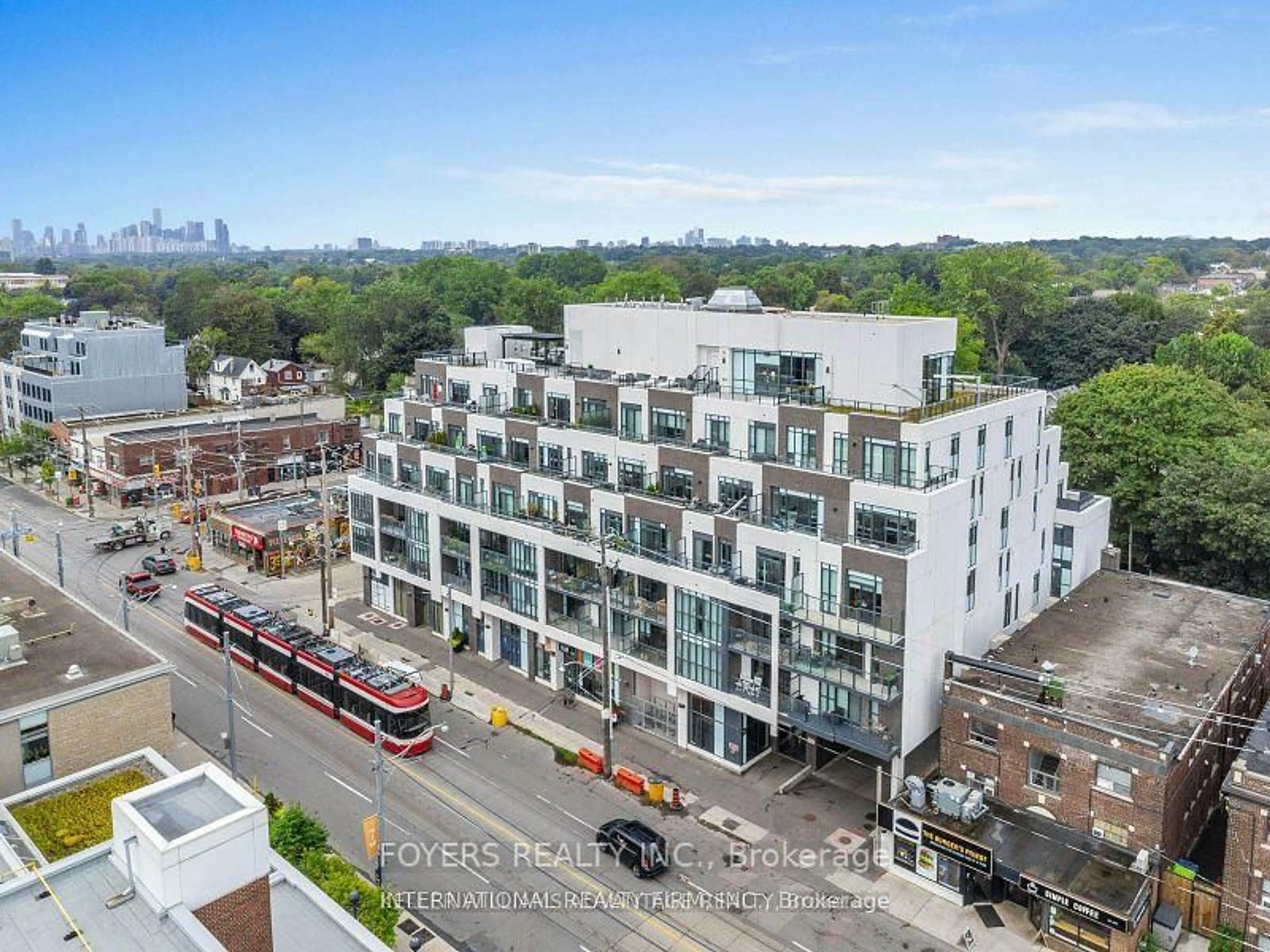 A pic from outside/outdoor area/front of a property/back of a property/a pic from drone, city buildings view from balcony for 1630 Queen St #314, Toronto Ontario M4L 1G3